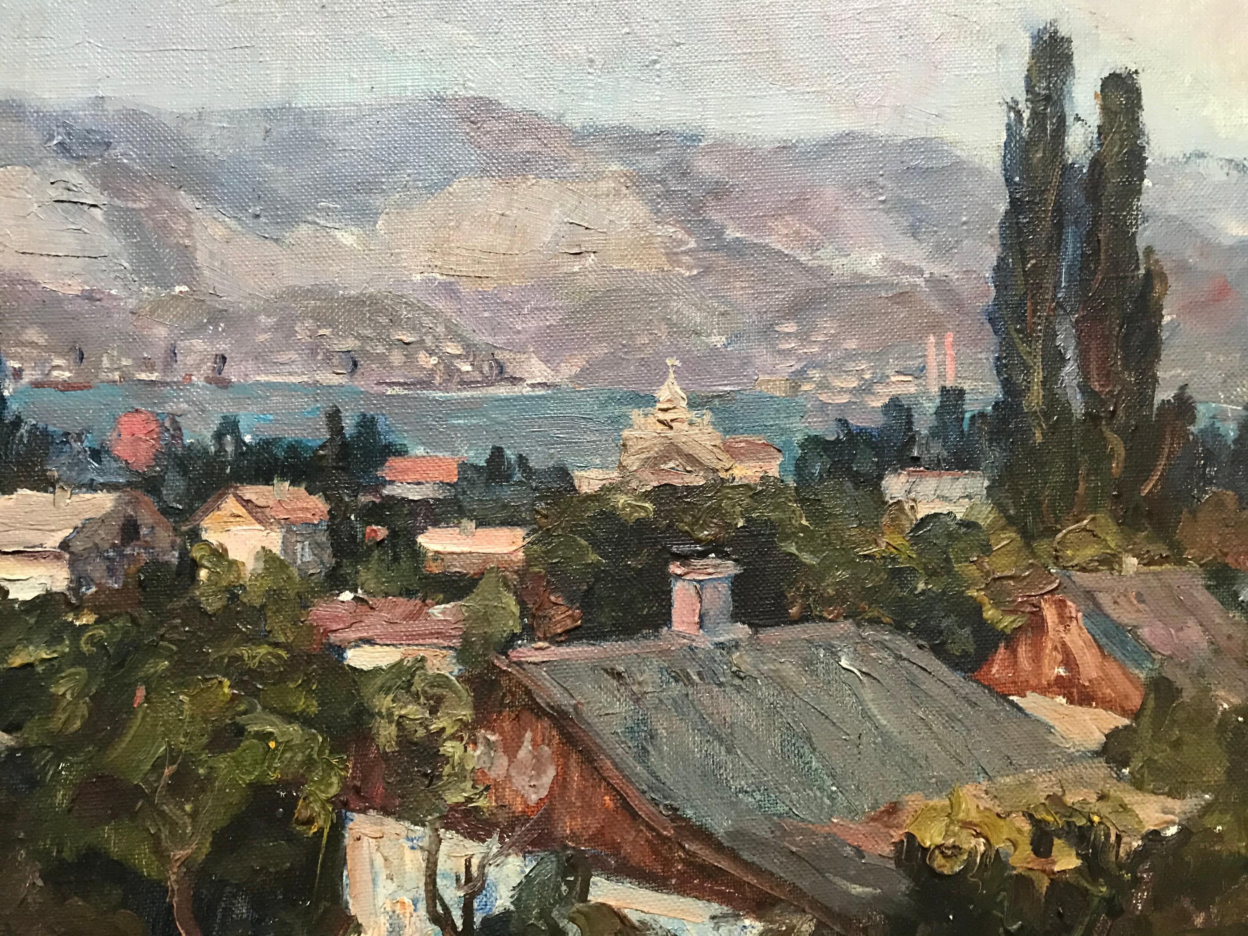 Another fine Impressionist oil painting from Ukraine. A pretty village is perched at the edge of a bay with ships in the harbor that have come in from the sea. In the distance is a range of purplish mountains. Nicely framed and ready to