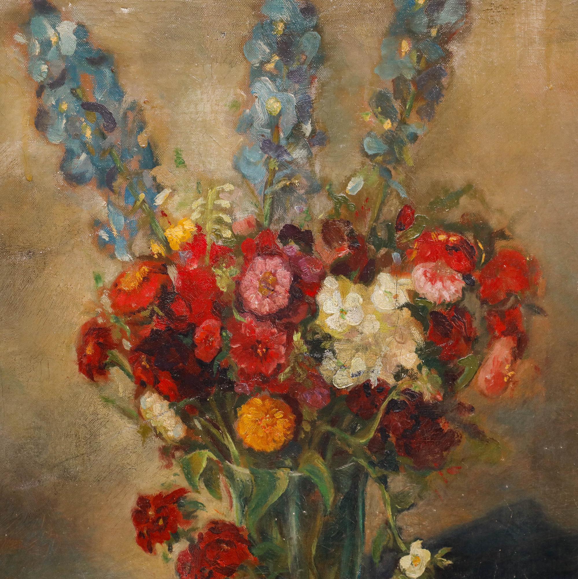 A delightful early 20th century Dutch oil depicting a bouquet of flowers with blue delphiniums. Signed to the upper right and verso. On canvas on stretchers.
