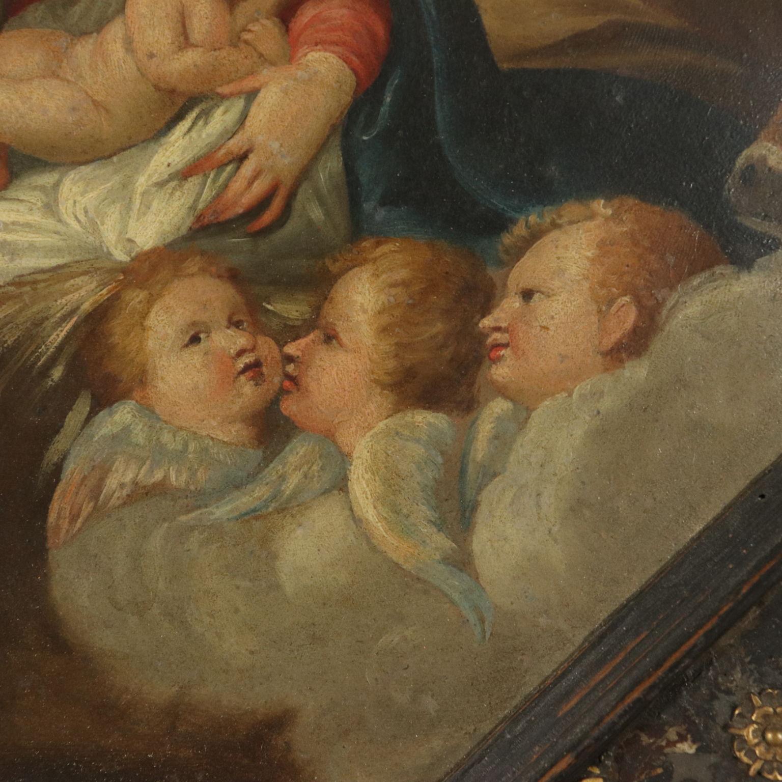 The Holy Family with Angels, oil on copper in octagonal frame, early XVII Century. Surrounding the Child sleeping in Mary's arms we find St, Joseph and several adoring angels. In the background a landscape. The painting is presented in a beautiful