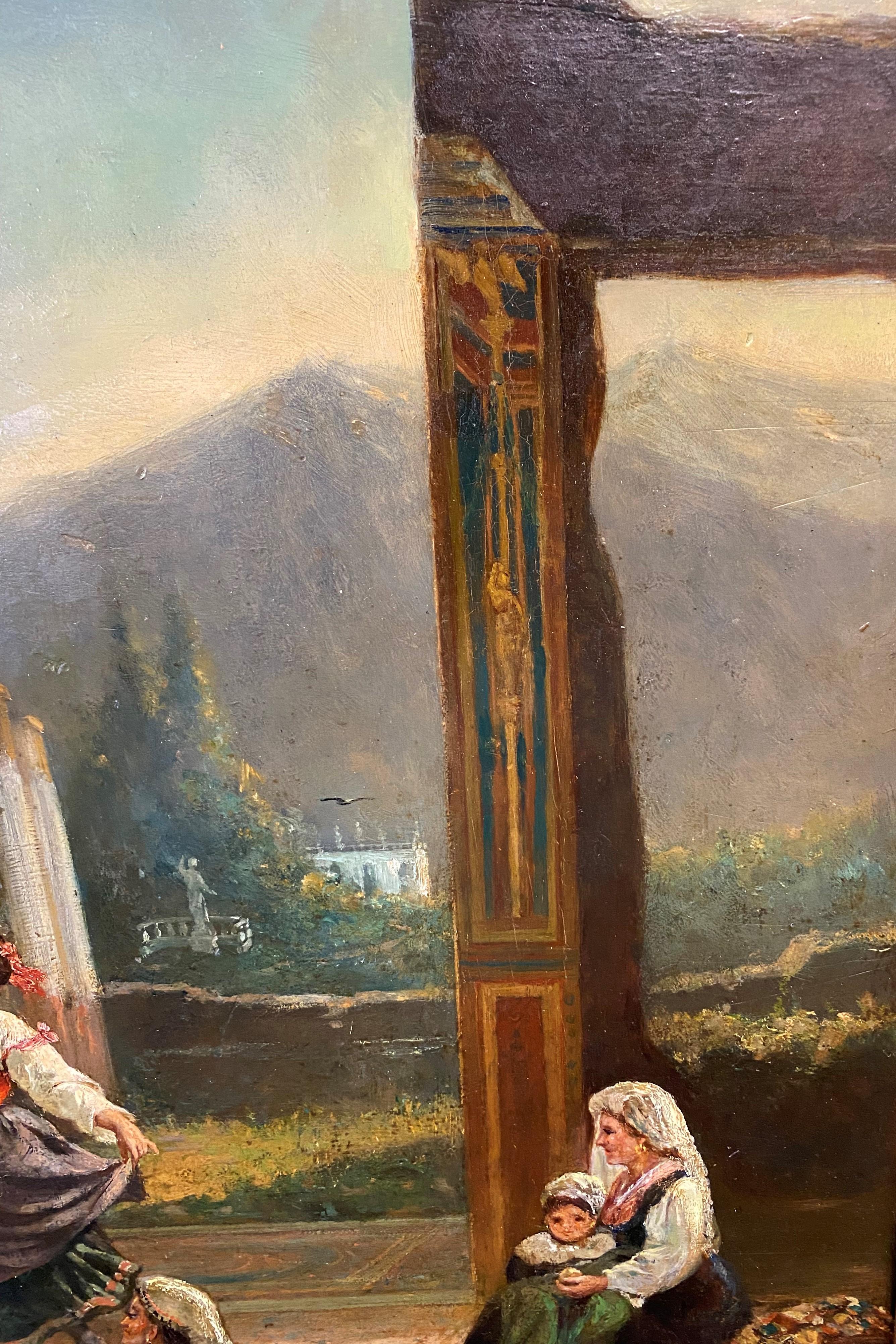 A fine 19th century Italian School oil painting on wood panel of an Italian landscape with figures dancing around a pool with a mountain background, unsigned, and housed in a carved period scroll decorated giltwood frame, with minor losses.