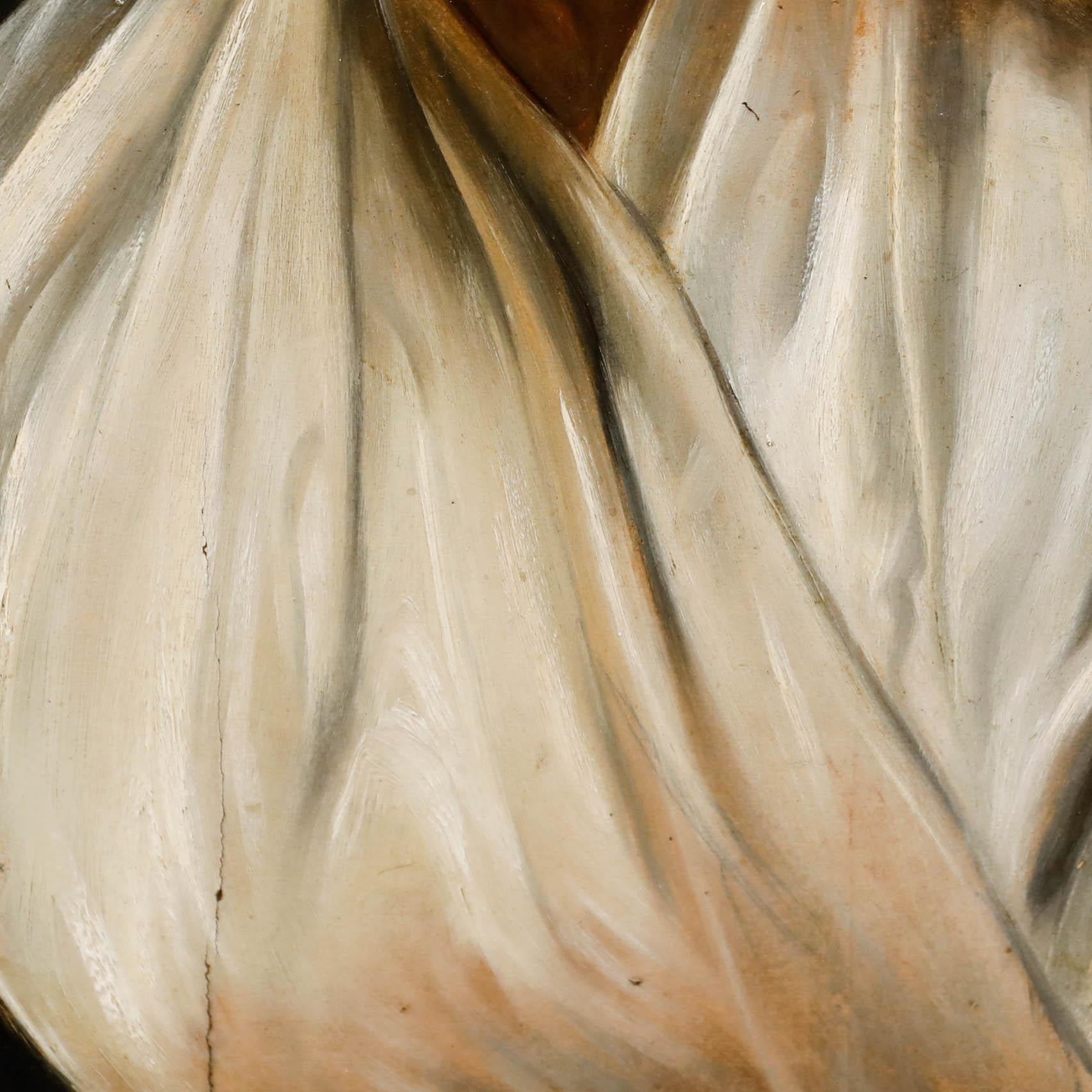 A charming portrait depicting an Italian woman in a headscarf and white robe. Unsigned. Presented in a wooden frame. On panel.