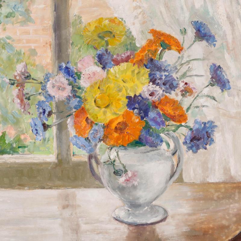 A bright still life scene depicting an array of summer flowers in a fine porcelain vase atop a shiny mahogany table. Signed to the lower right. Well presented in a painted cream frame. On board. Image size: 44.5 x 53.5cm.