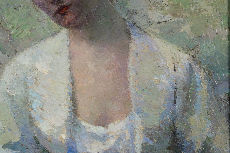 A simply stunning Eastern European impressionist oil on board portrait of a seated young woman lost in thought as she looks off to the side. The piece is beautifully painted in subtle shades of blue and green and has wonderful texture from the use
