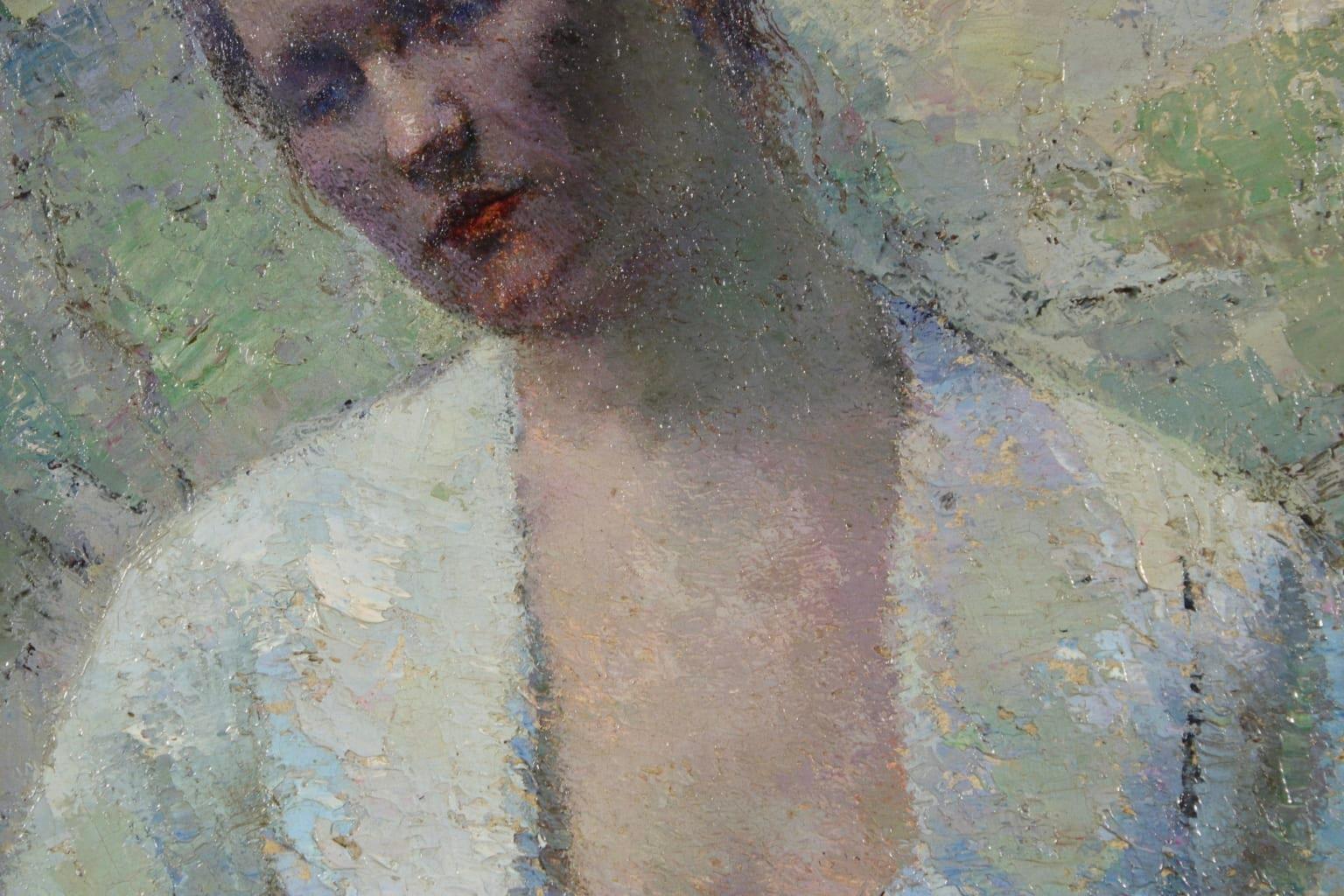 A simply stunning Eastern European impressionist oil on board portrait of a seated young woman lost in thought as she looks off to the side. The piece is beautifully painted in subtle shades of blue and green and has wonderful texture from the use