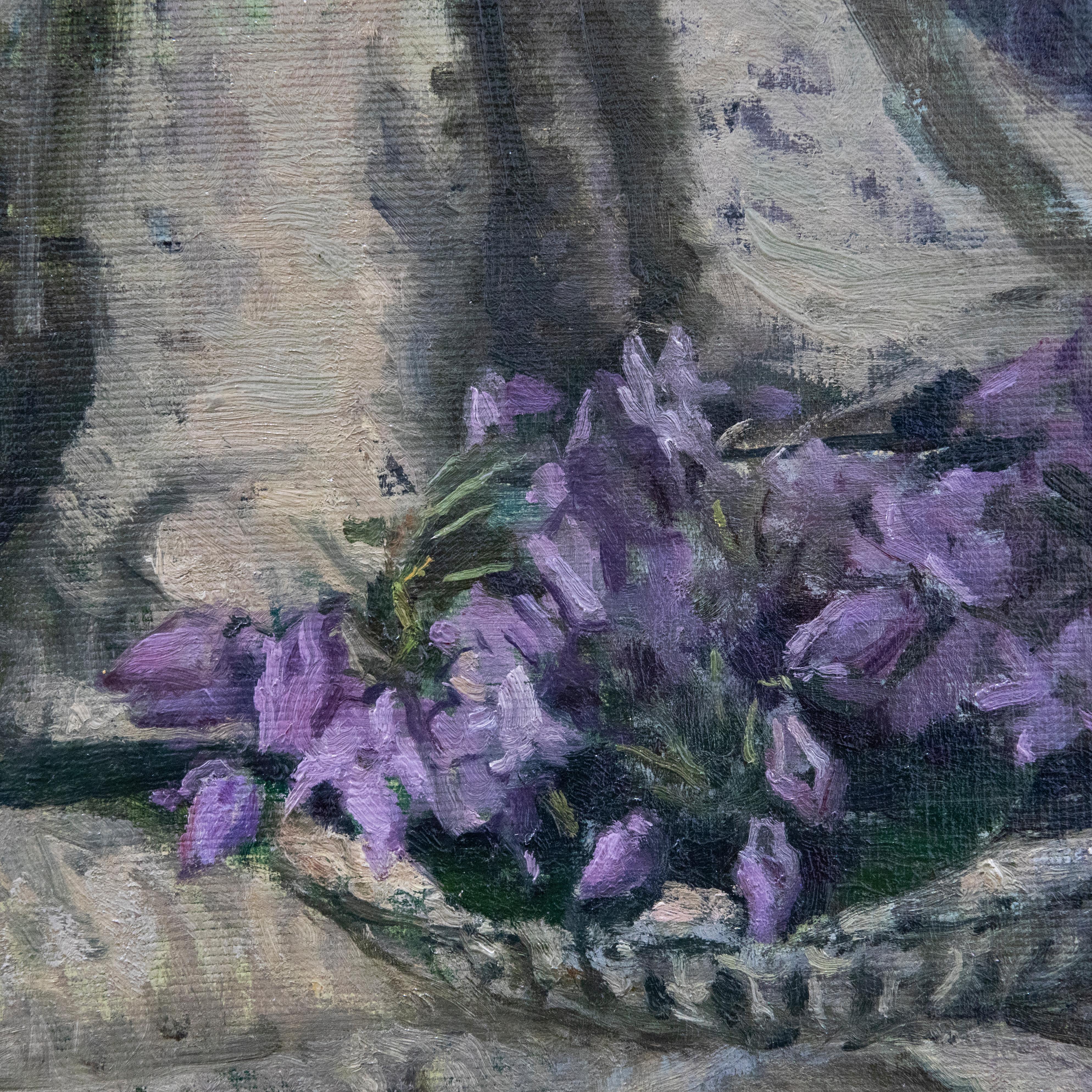 A particularly fine impressionistic study of purple violets in a scalloped dish, precariously placed on a wooden chair with floral drape. Well-presented in a contemporary silver-effect frame. Signed to the upper left. On canvas board. 