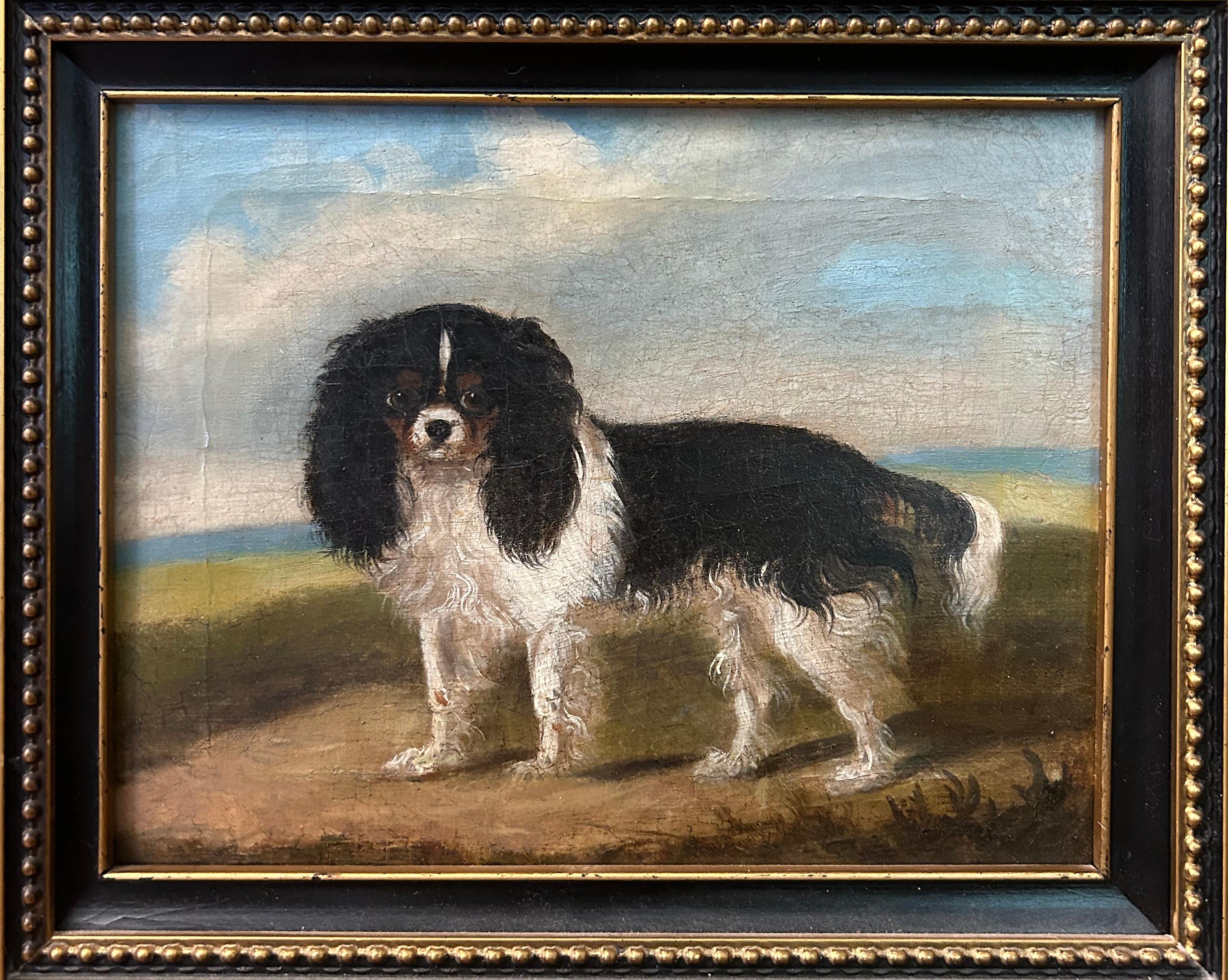 This early to mid 19th century diptych features a pair of King Charles Spaniels, one with a Blenheim coat (left) and one with a black coat. The unidentified artist chose a medium of oil on canvas for the canines, and presents the dogs in a realist