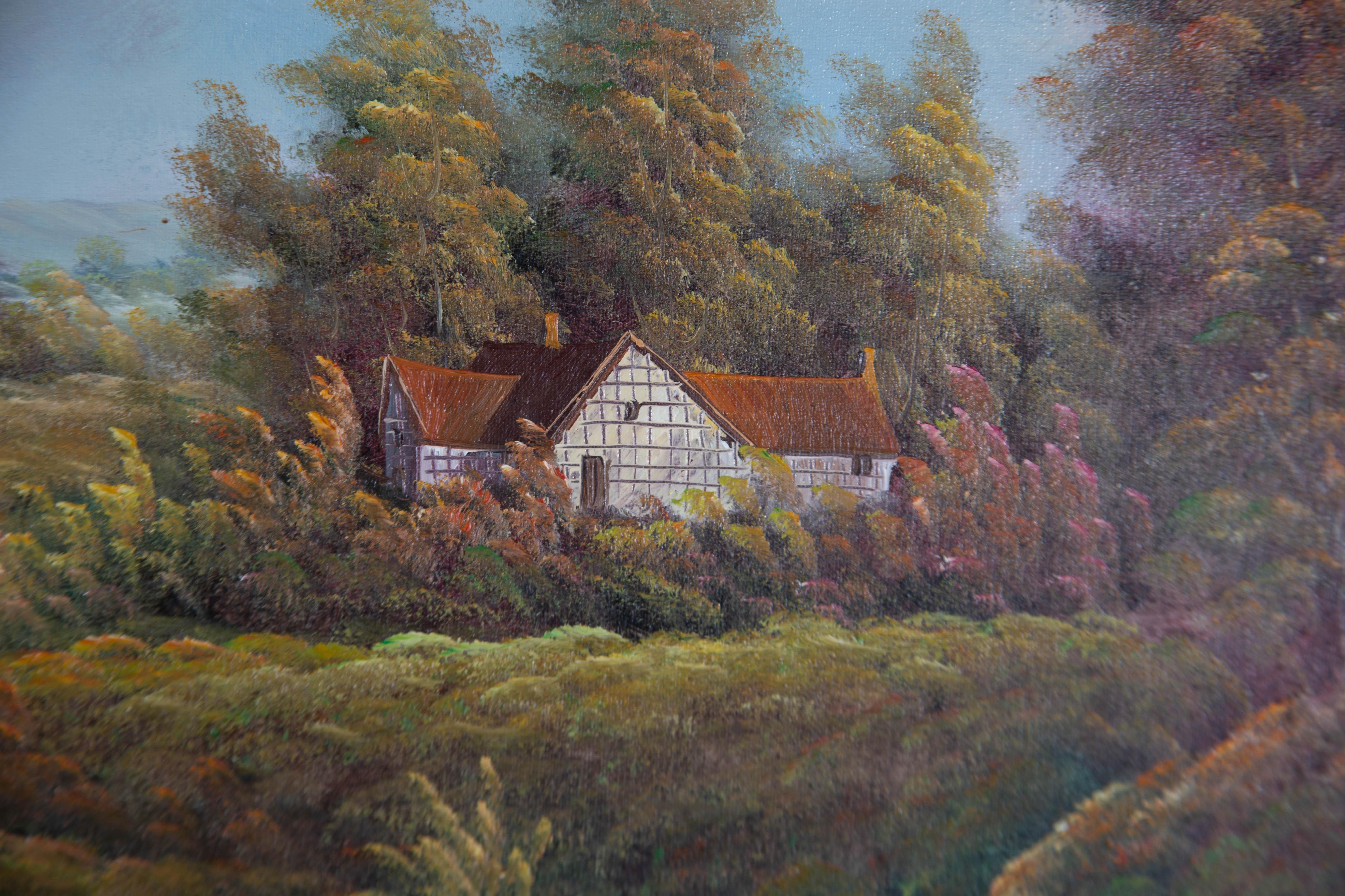 A large rustic landscape depicting a cottage beside a lake. Presented in a gilt-effect wooden frame with an ornate outer edge and a linen slip. Unsigned. On canvas on stretchers.
