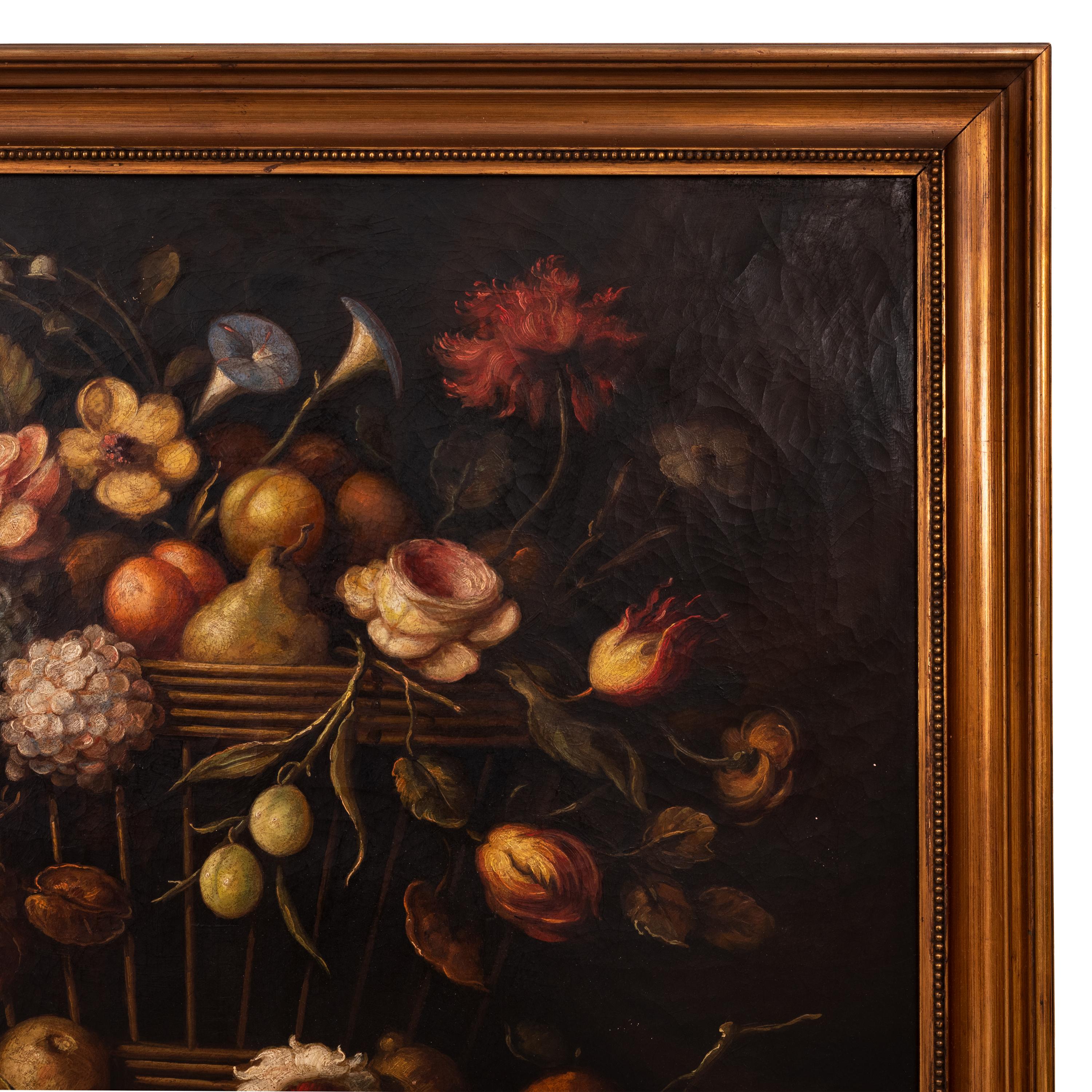 A very good antique late 18th century oil on canvas still life painting, Dutch School, circa 1780.
The painting of horizontal orientation & depicting a basket rested on a table containing a host of flowers and fruit, to the front of the basket is