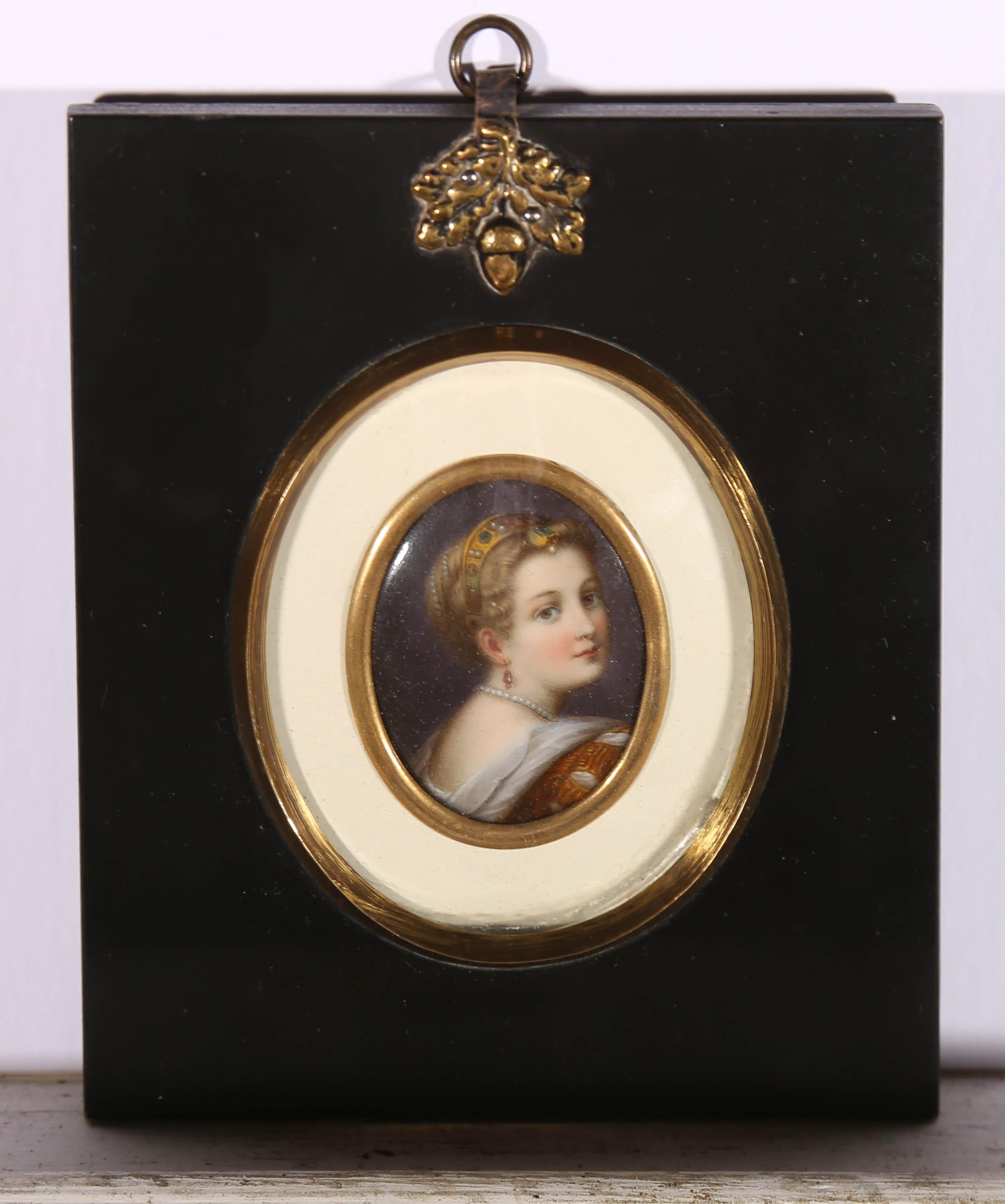 A fine enamel on porcelain, oval miniature of a titanesque female wearing a jewel set gold hair ornament, earrings and pearl necklace. Very well presented in an original papier mache frame with a brass acorn hanger and original domed glazing. On
