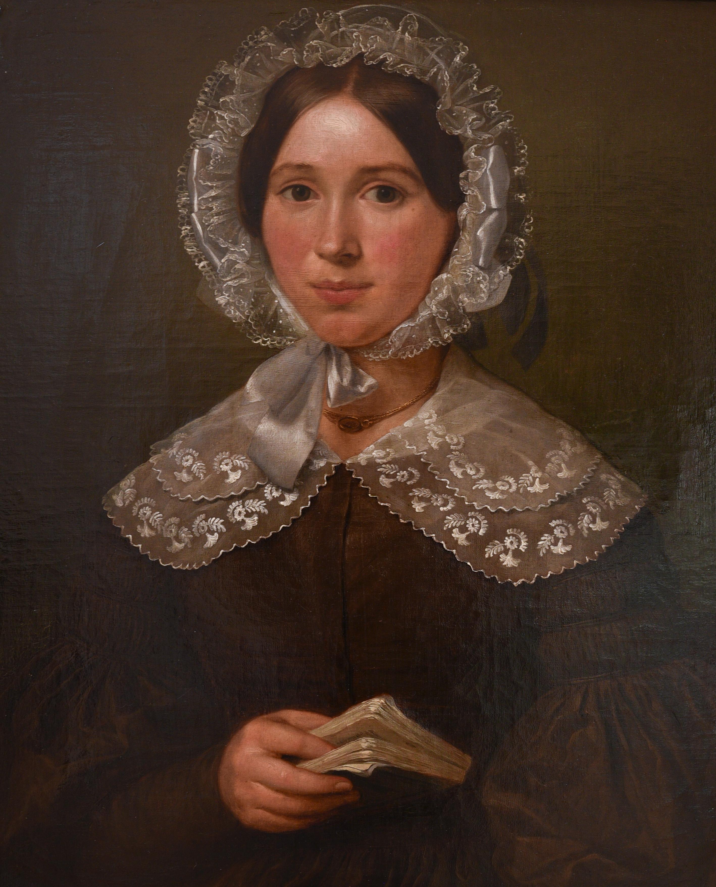 Unsigned oil on board painting painting of a 19th century woman holding a book and dressed with a lace hat and collar. The level of detail in the lace is of the highest quality and so is the expression of the face. 

We believe the painting