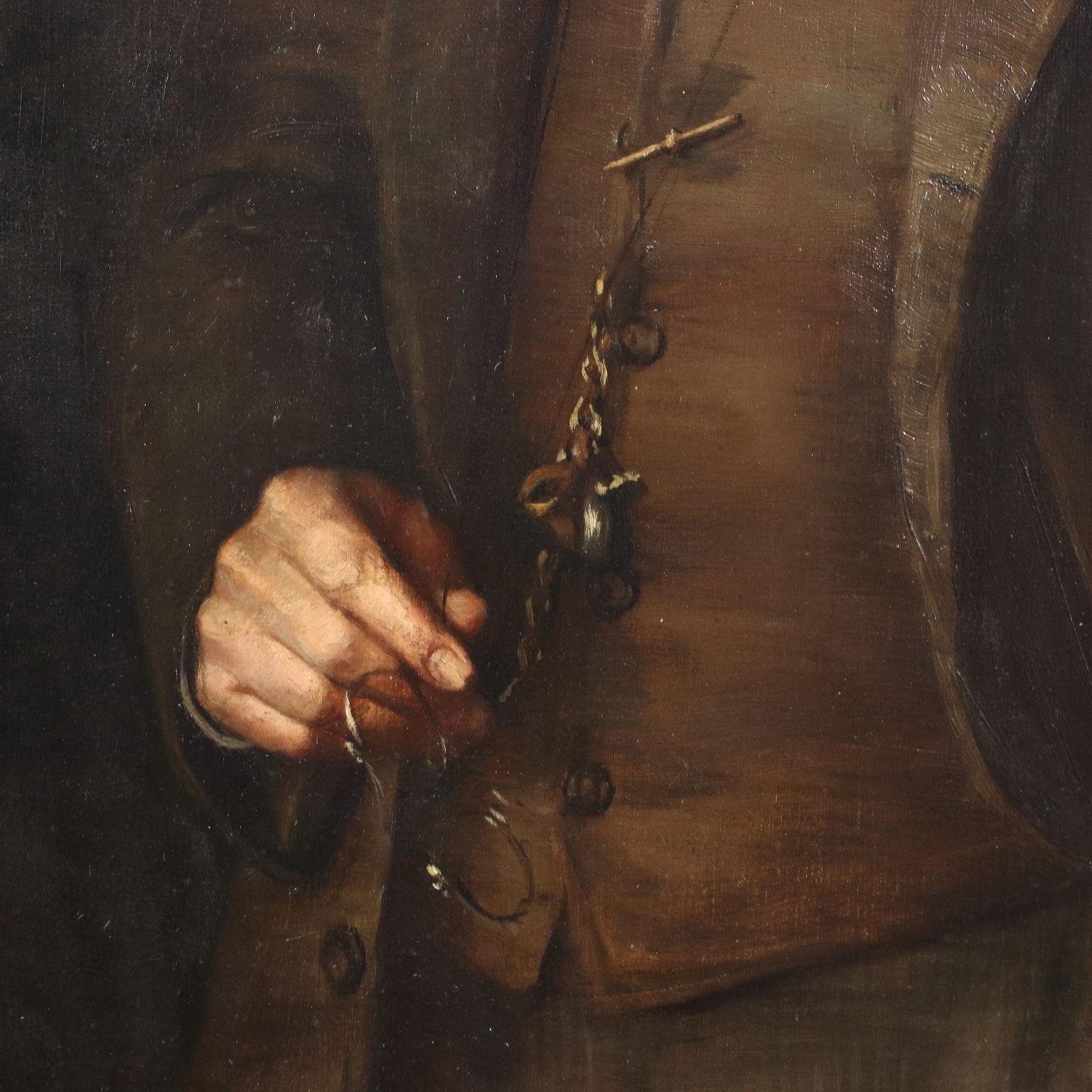 Oil painting on canvas. Distinguished gentleman in a waistcoat with a watch chain and goggles, he is portrayed with a concentrated gaze, absorbed in his thoughts. The painting is presented in a styled frame.