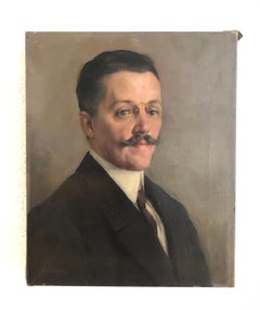 Man with mustache and glasses