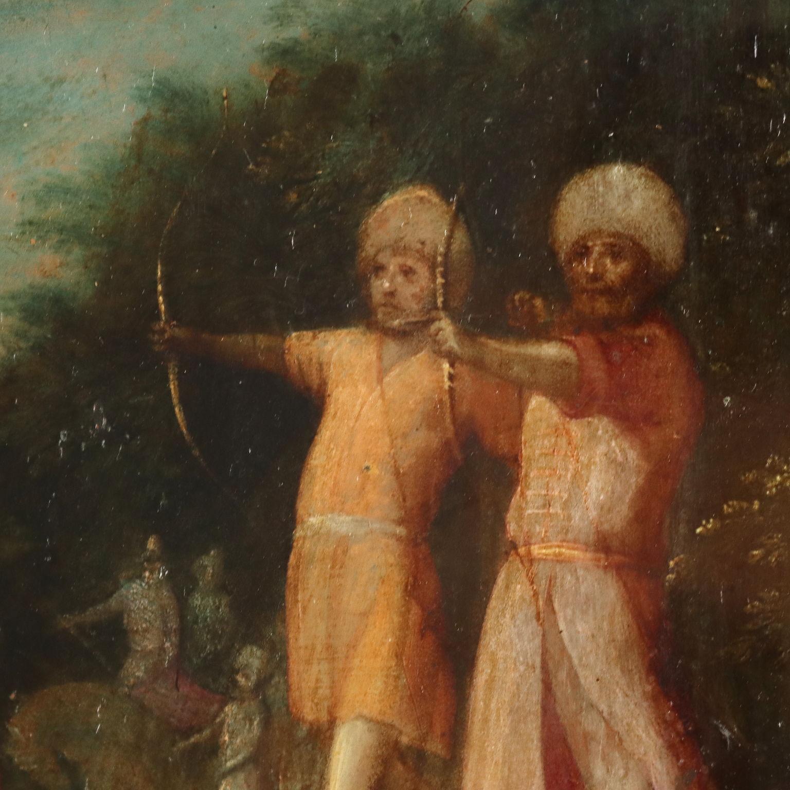 Oil on copper. The young Saint Sebastian, tied to a tree (according to tradition on the Palatine Hill, outside the walls of Rome that can be seen in the background), undergoes martyrdom, pierced by arrows shot by two Moors. It is the traditional