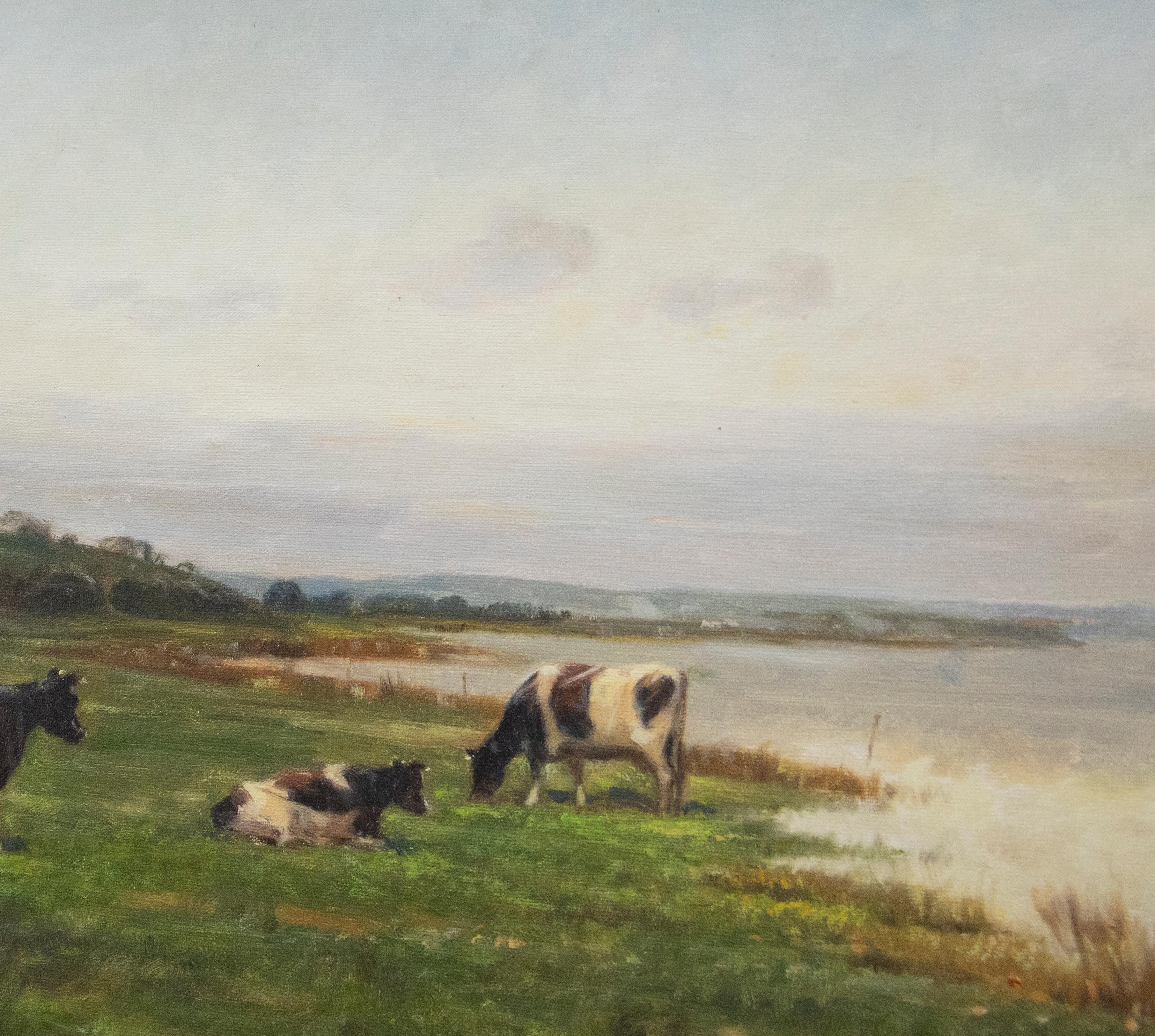 An accomplished oil painting by the Danish artist Michael Stephanou (b.1937). The scene depicts several milking cows peacefully grazing by a river. The composition has been signed by the artist to the lower left. Well presented in a gilt-effect