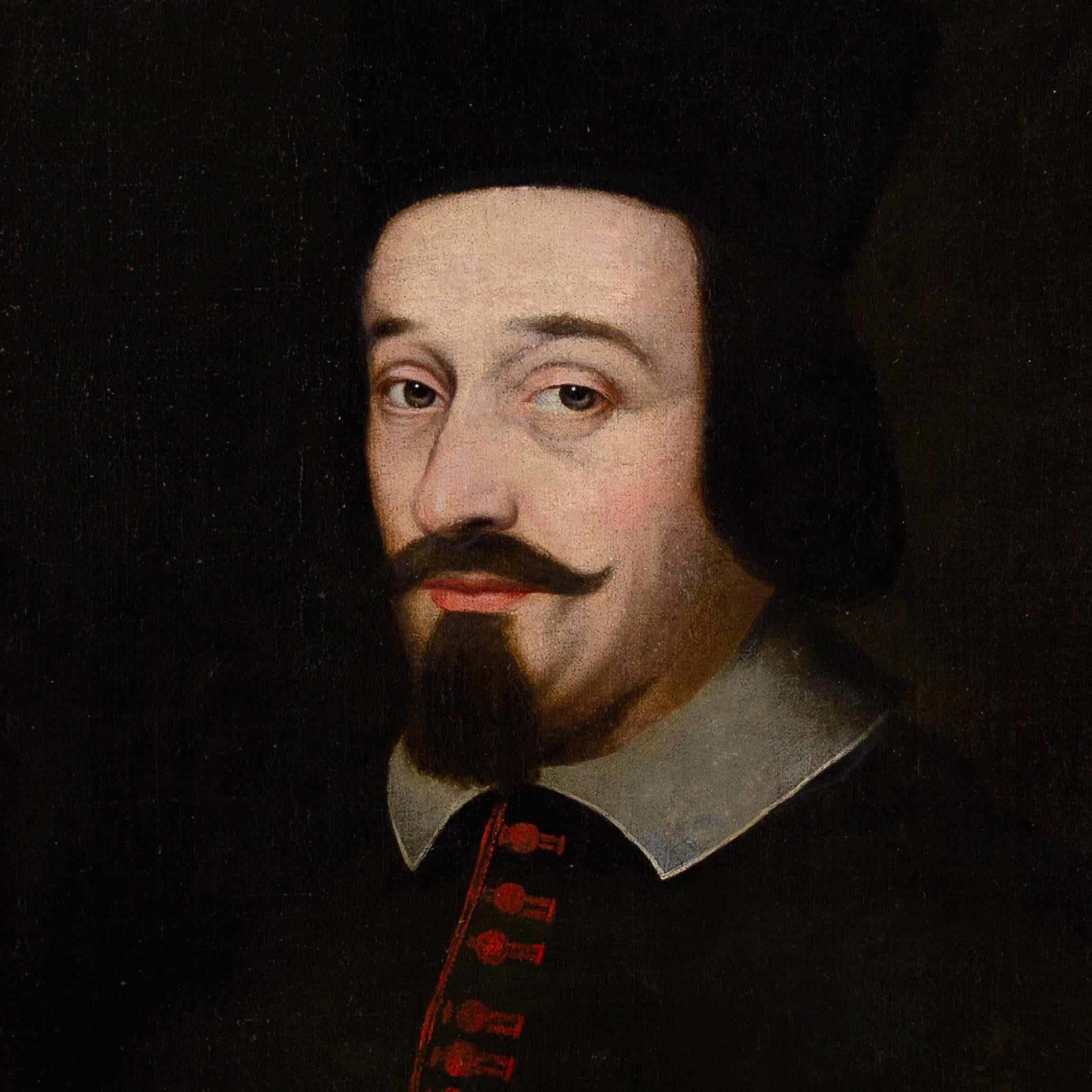 Dieses spanische Ölgemälde aus der Mitte des 17. Jahrhunderts stellt einen würdigen Gelehrten dar - einen Theologen oder vielleicht einen Domherrn.

Bekleidet mit einer schwarzen Soutane, die durch eine vertikale Reihe roter Knöpfe oder Stickereien