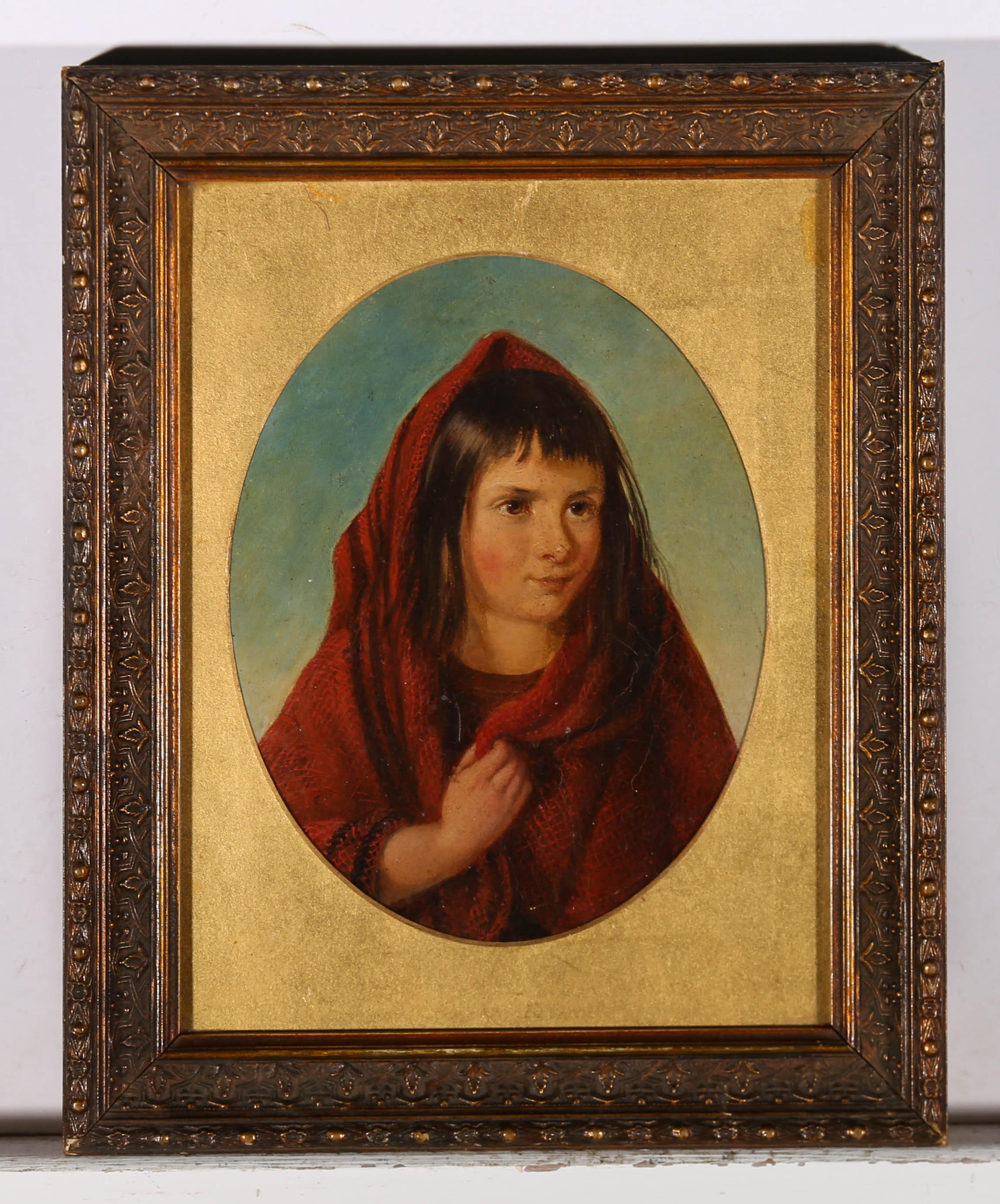 A charming mid 19th Century oil portrait of a softly smiling little girl with dark hair. She is wearing a woven red shawl over her head which she holds together at her chest. The red of her shawl contrasts nicely with the blue of the sky behind her.