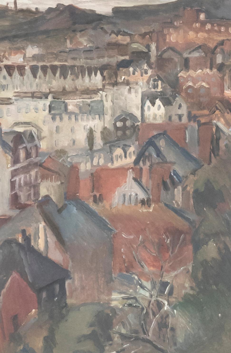 A charming oil study depicting a sweeping view over a town with lined terraced houses. Unsigned. Presented in a light wooden frame. On paper.
