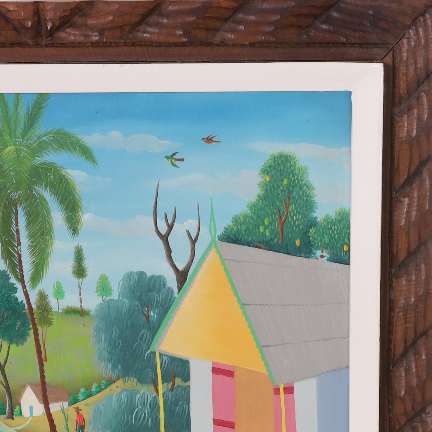 Extravagante pintura acrílica vintage haitiana sobre tabla que representa una idílica aldea rural ejecutada con una juguetona técnica ingenua. Firmado Phiton Latortue y presentado en el marco original de madera tallada.