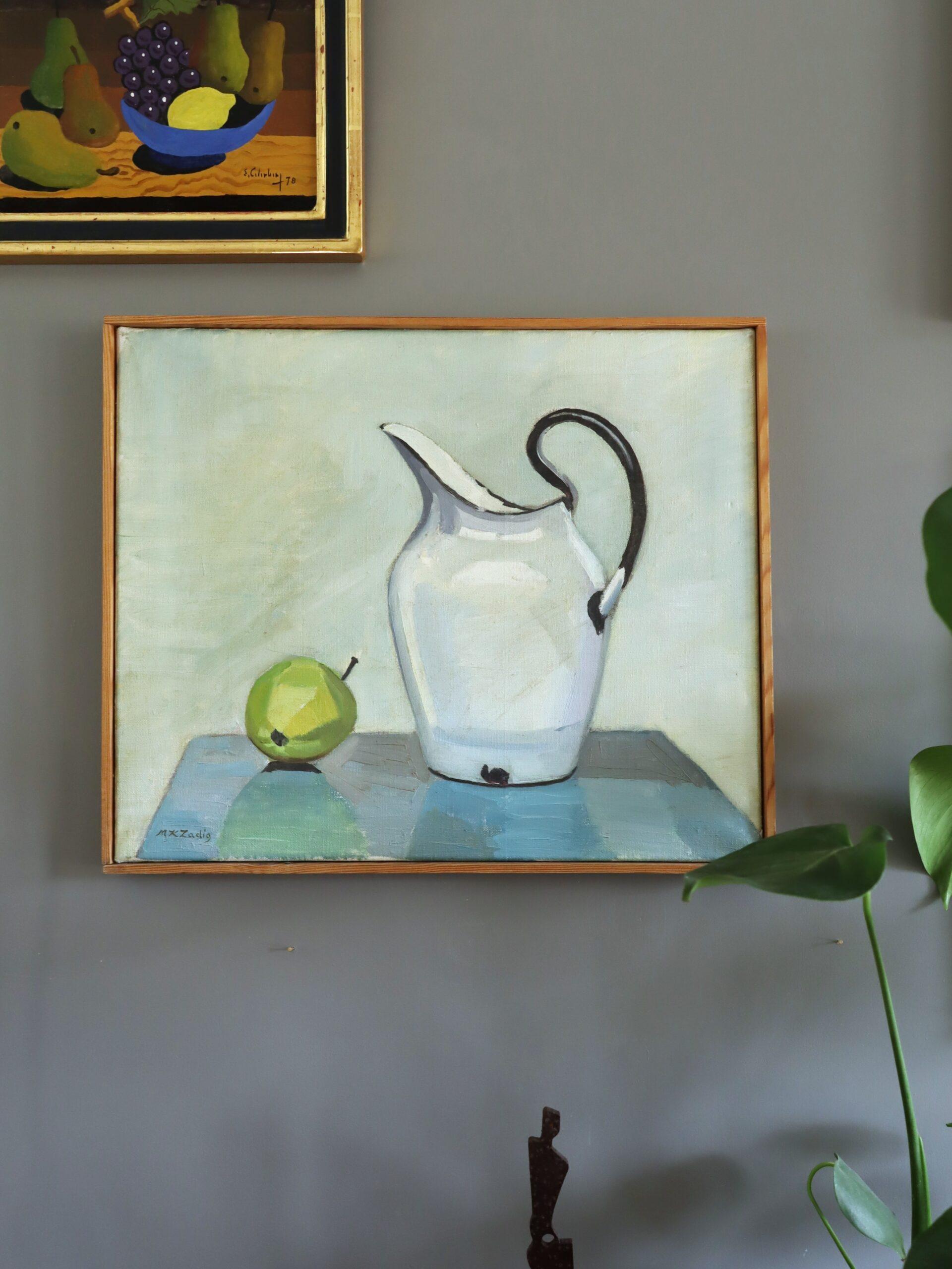 PEAR & PITCHER
Size: 39.5 x 47.5 cm (including frame)
Oil on canvas

An elegant mid-century still life composition that presents a pared-back arrangement of a single green pear alongside a white pitcher, executed in oil onto canvas.

The painting is