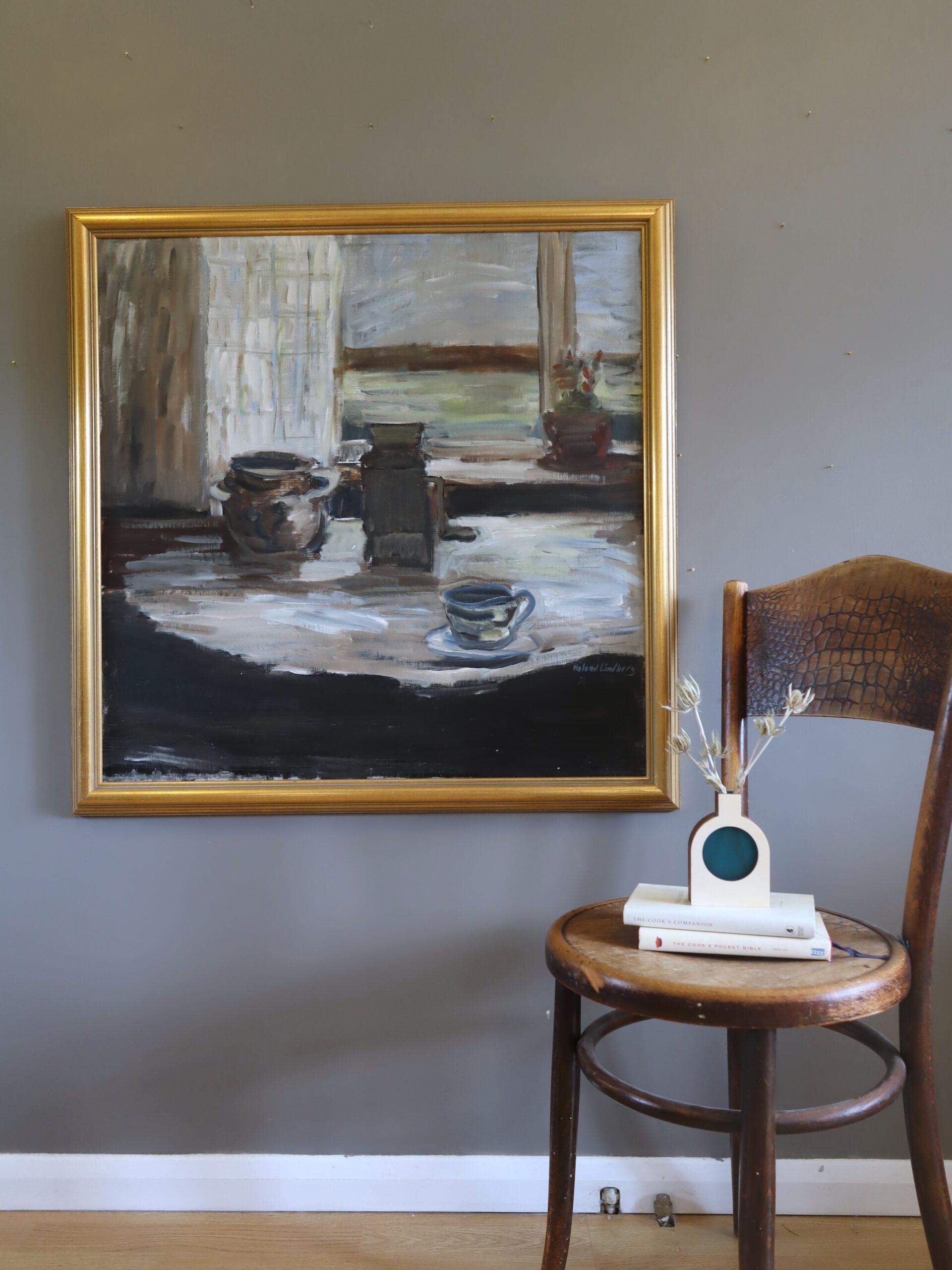 QUIET HOURS
Size: 73.5 x 78.5 cm (including frame)
Oil on canvas

A large and expressive mid-century interior still life that captures a quiet, contemplative moment within a rustic domestic space,  executed in oil onto canvas.

A sunlit table by the