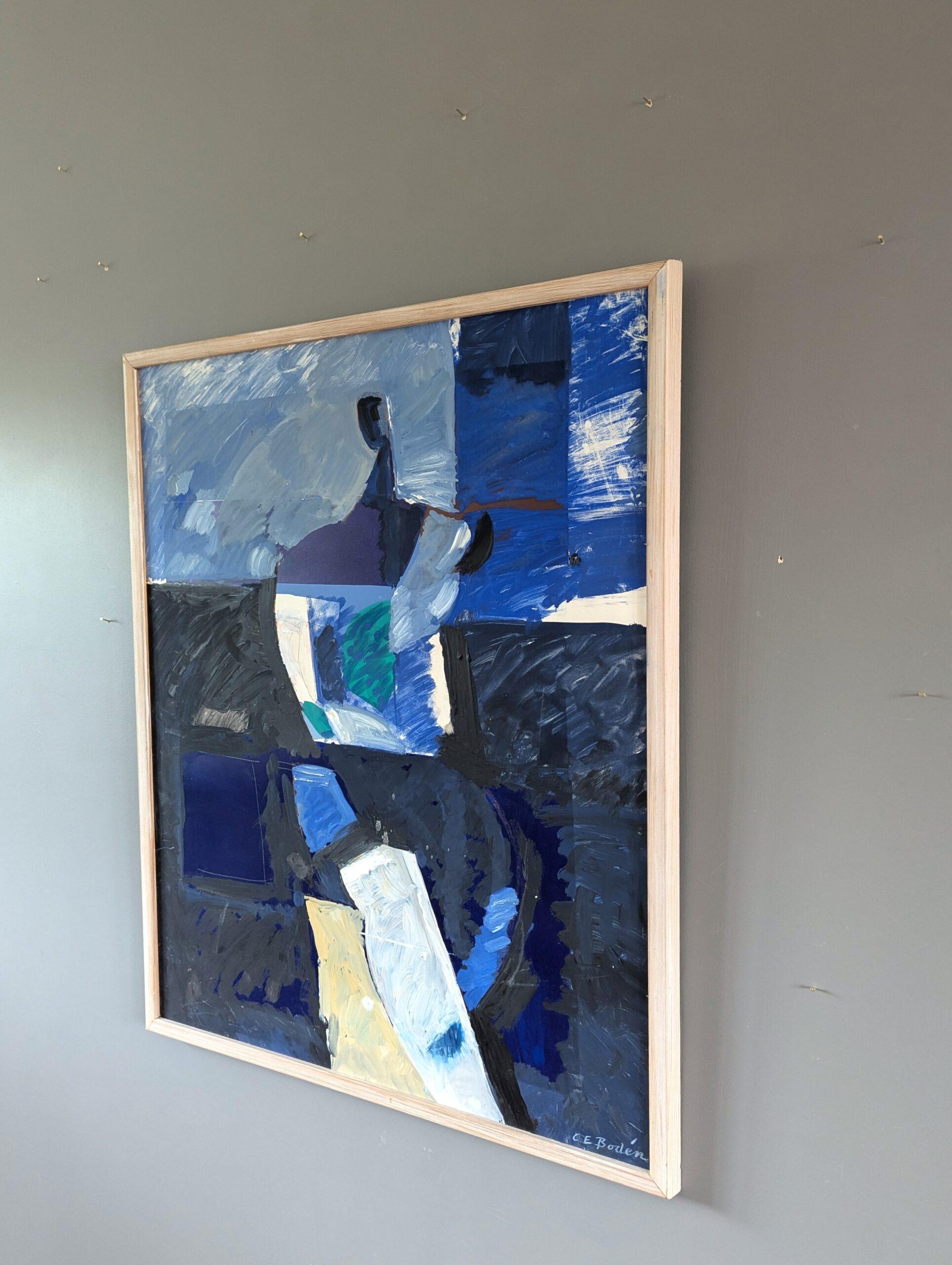 FIGURA ASTRATTA IN BLU
Dimensioni: 73 x 59,5 cm (cornice inclusa)
Olio su tavola

Un sorprendente dipinto astratto modernista di metà secolo che presenta una figura seduta frammentata e astratta, resa attraverso un gioco dinamico di forme