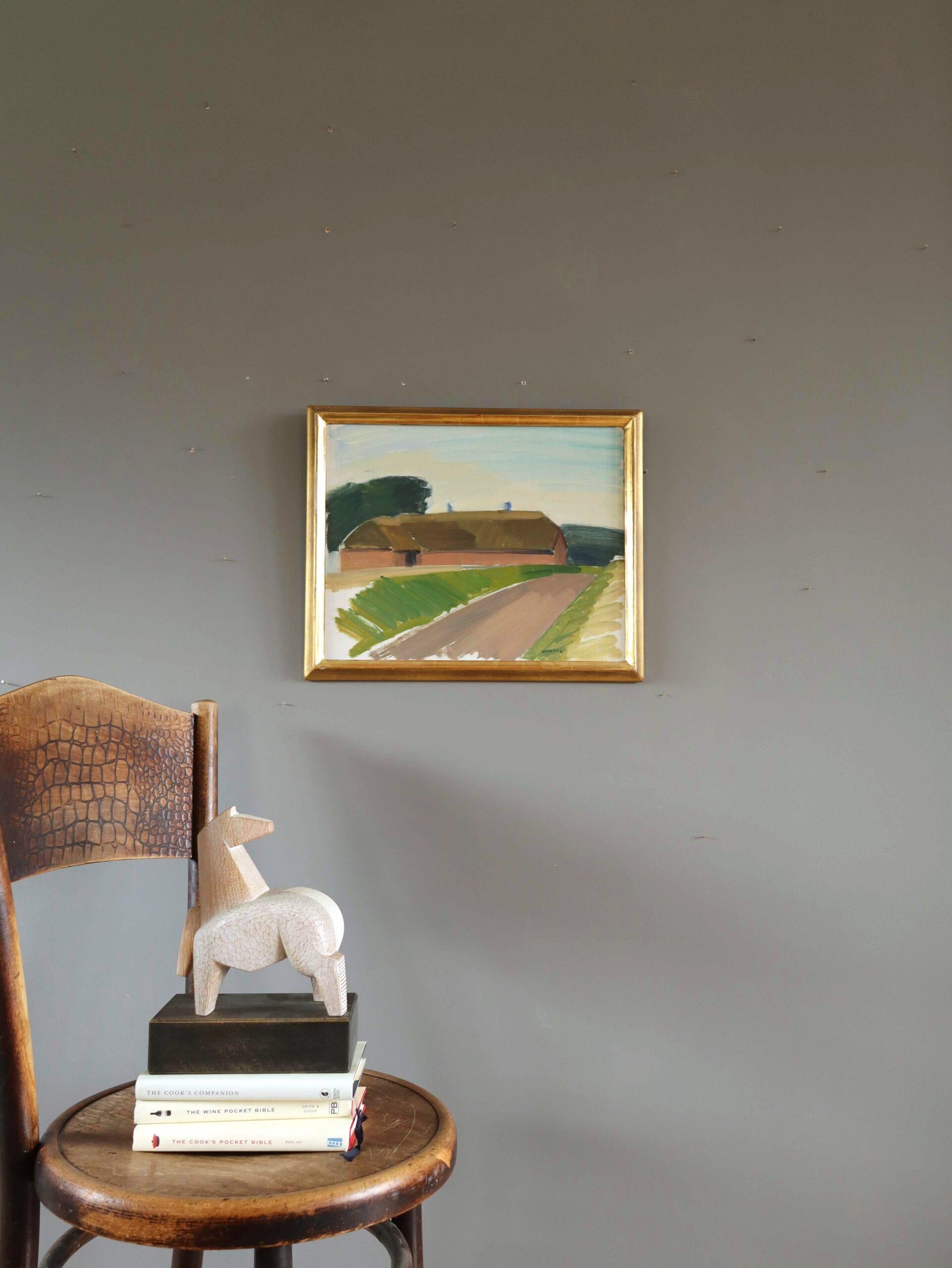 BARN BY COUNTRY ROAD
Size: 36 x 44 cm (including frame)
Oil on board

A charming mid-century modernist street scene composition, executed in oil onto board.

The painting captures a quiet moment in the countryside, where a road leads past a barn