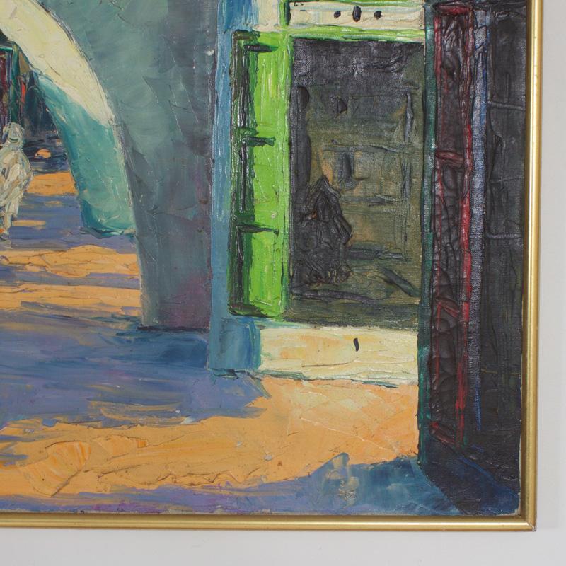 Mid Century acrylic on canvas painting of a Middle Eastern Street scene executed with bold impressionistic brush strokes. Depicting exotic Architecture with shadowy figures and colorful doorways. Signed J. Ferrer at the bottom.
