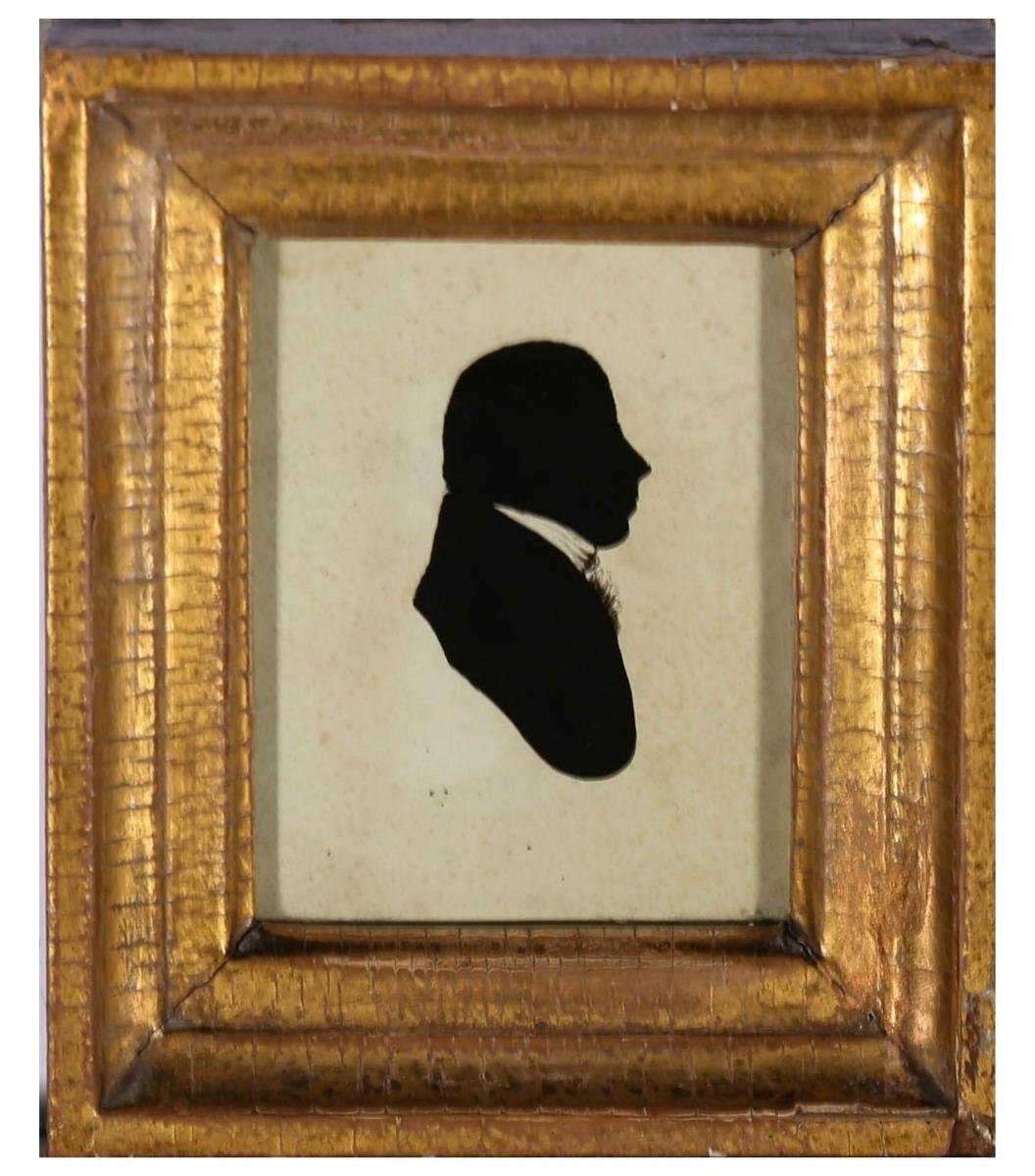 A charming silhouette miniature of a Georgian gentleman, with large ruffle and high collared jacket. This side profile has been painted to the reverse of the glass in oil with a laid backing slip. Presented in a handsome deep set gilt frame, well