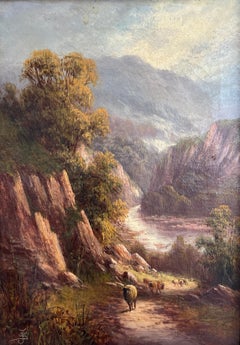 Landschaft im Berggebirge mit Schafen an einem Fluss