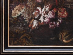 Still life with flowers, fruits, historiated vases, a parrot and a monkey
