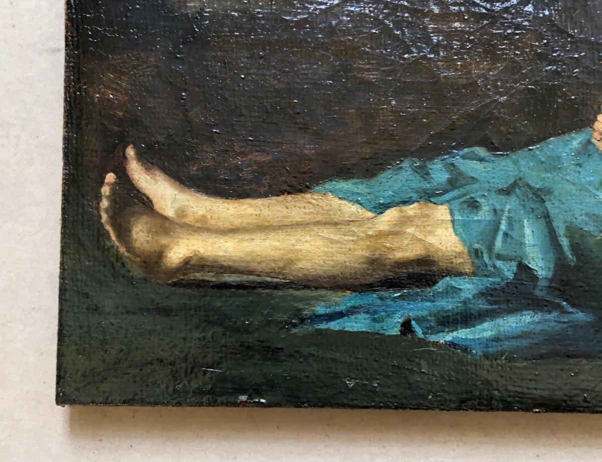 Amid the artistic fervor of the mid-19th century, a striking oil on canvas emerged, capturing the ethereal form of a resting nude woman. Measuring a medium size, the artwork is bathed in a study of contrasts. The backdrop, painted in deep, somber