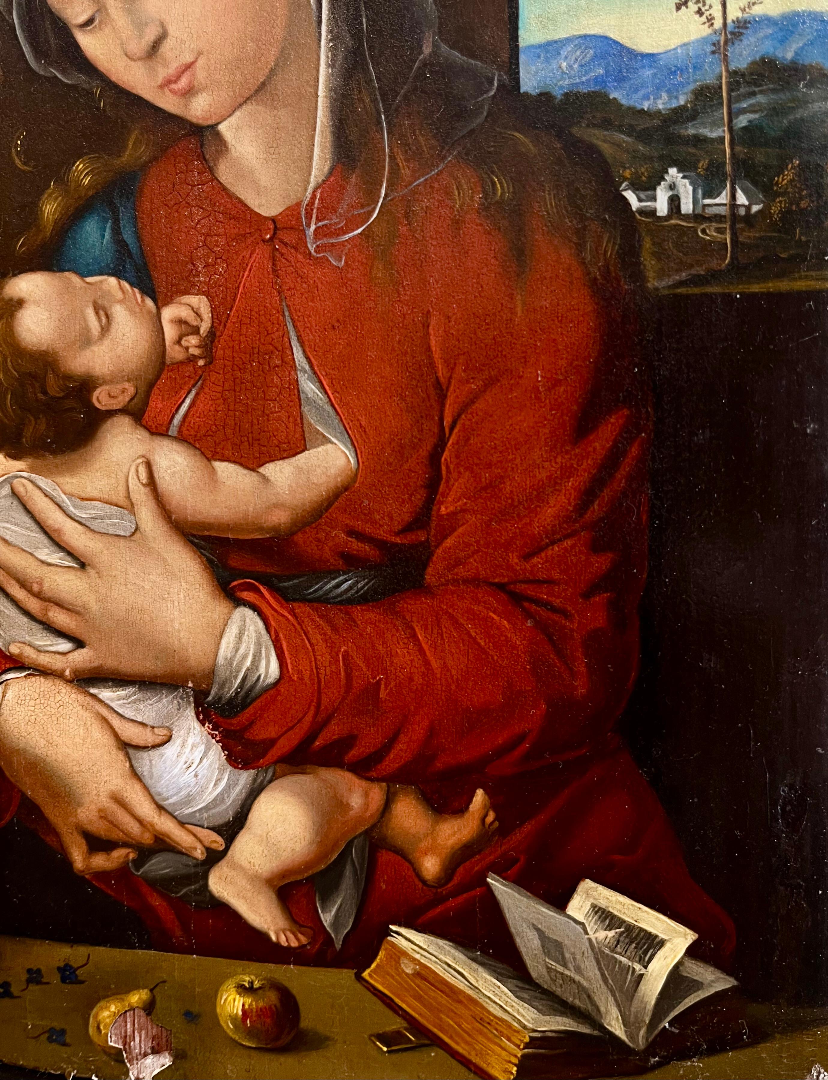 Questa squisita copia dell'inizio del XIX secolo di un dipinto di Madonna e Bambino del XVI secolo esemplifica la devozione spirituale e la maestria artistica caratteristica del periodo rinascimentale. La Vergine Maria è ritratta con grazia serena,