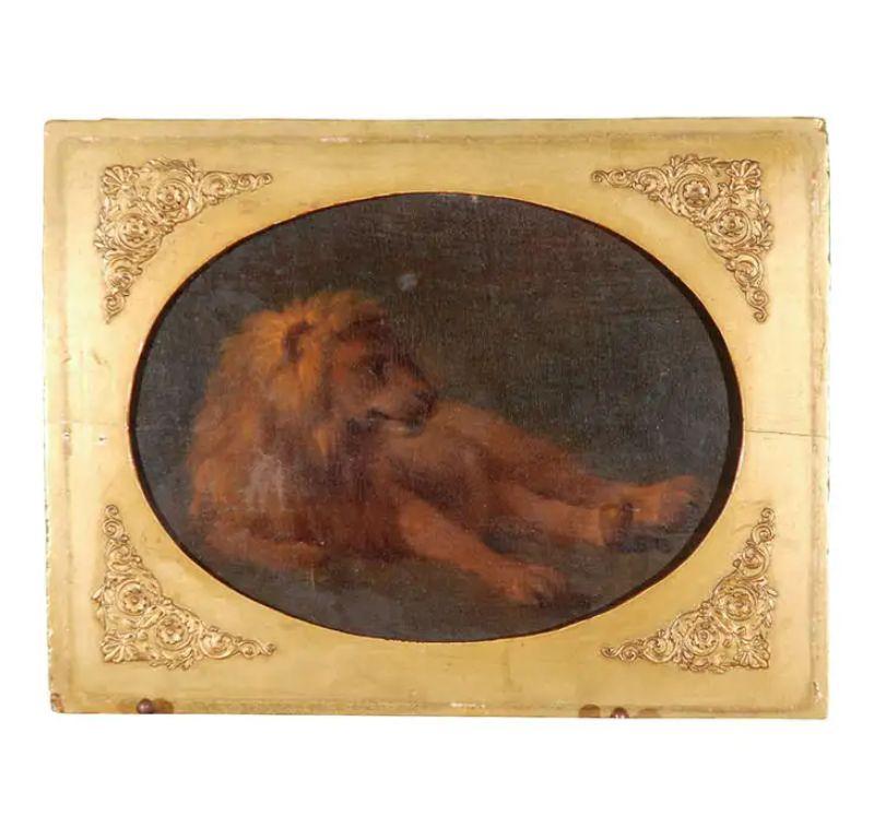 Beautifully painted, oil-on-panel of a recumbent lion in its original, gilded wood frame.