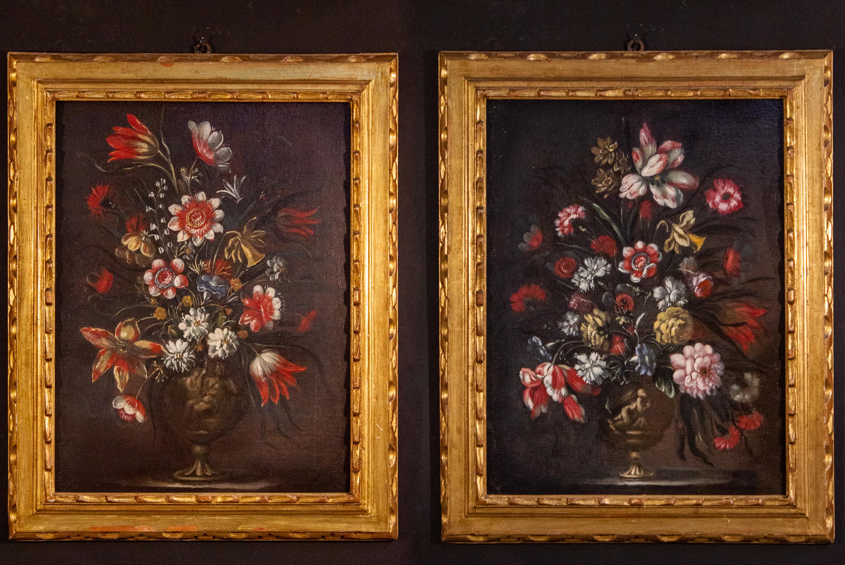 Pair of very decorative Italian Still-life paintings of flowers with vases and classical figures .
18th century, oil on canvas,  with original gilt-wood frames. 
This pair is an excellent example of the Italian  trend of emulating the Flemish still