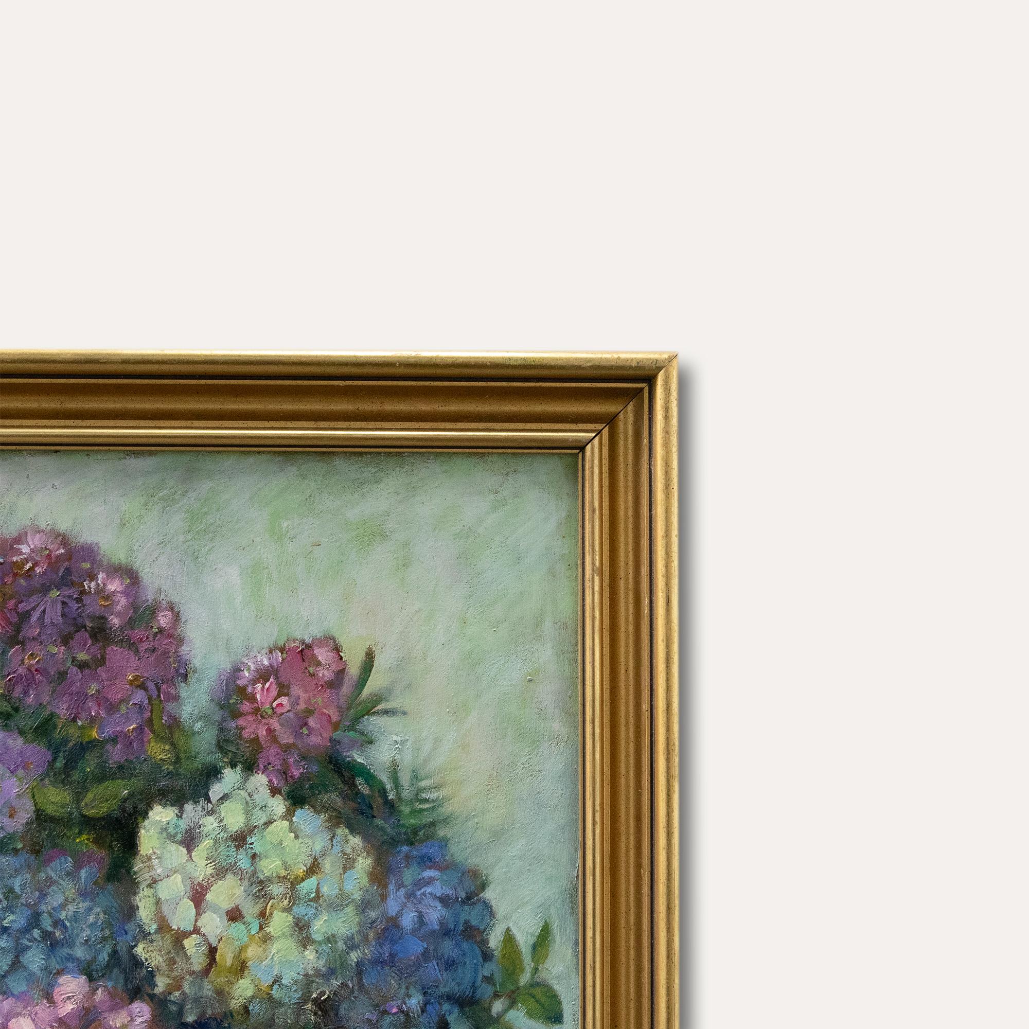 A charming oil study depicting a vibrant vas of pink, white and blue hydrangeas. Painted in an impressionist style, the artist uses gestural brush strokes to capture a sense of movement in the still life study. Signed to the lower right. Presented