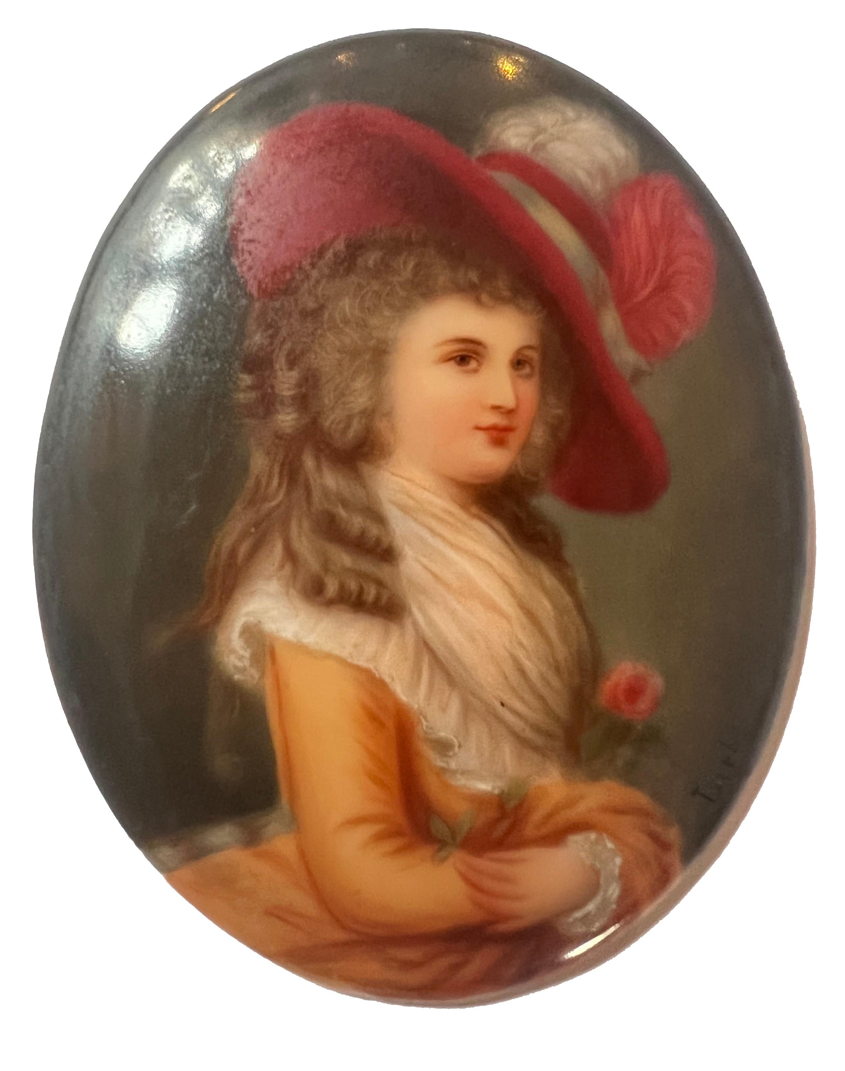 A very good quality early 19th Century Austrian, Vienna style convex porcelain plaque depicting a hand painted portrait of the 