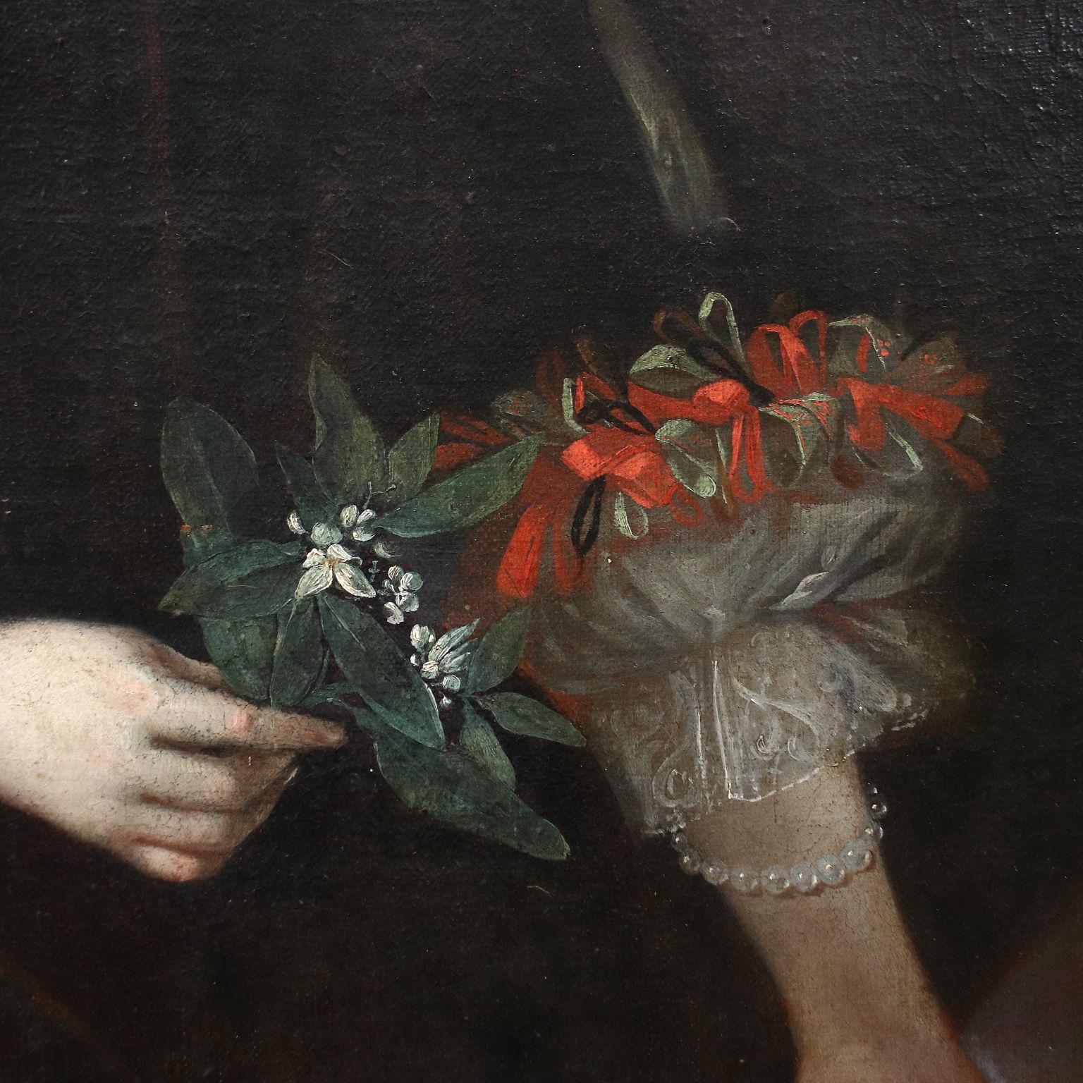 Oil painting on canvas. Lombard school of the seventeenth century. A smiling young girl is portrayed in an elegant black dress, embellished with lace on the neckline and a play of red and green laces and ribbons on the sleeves, which match the red