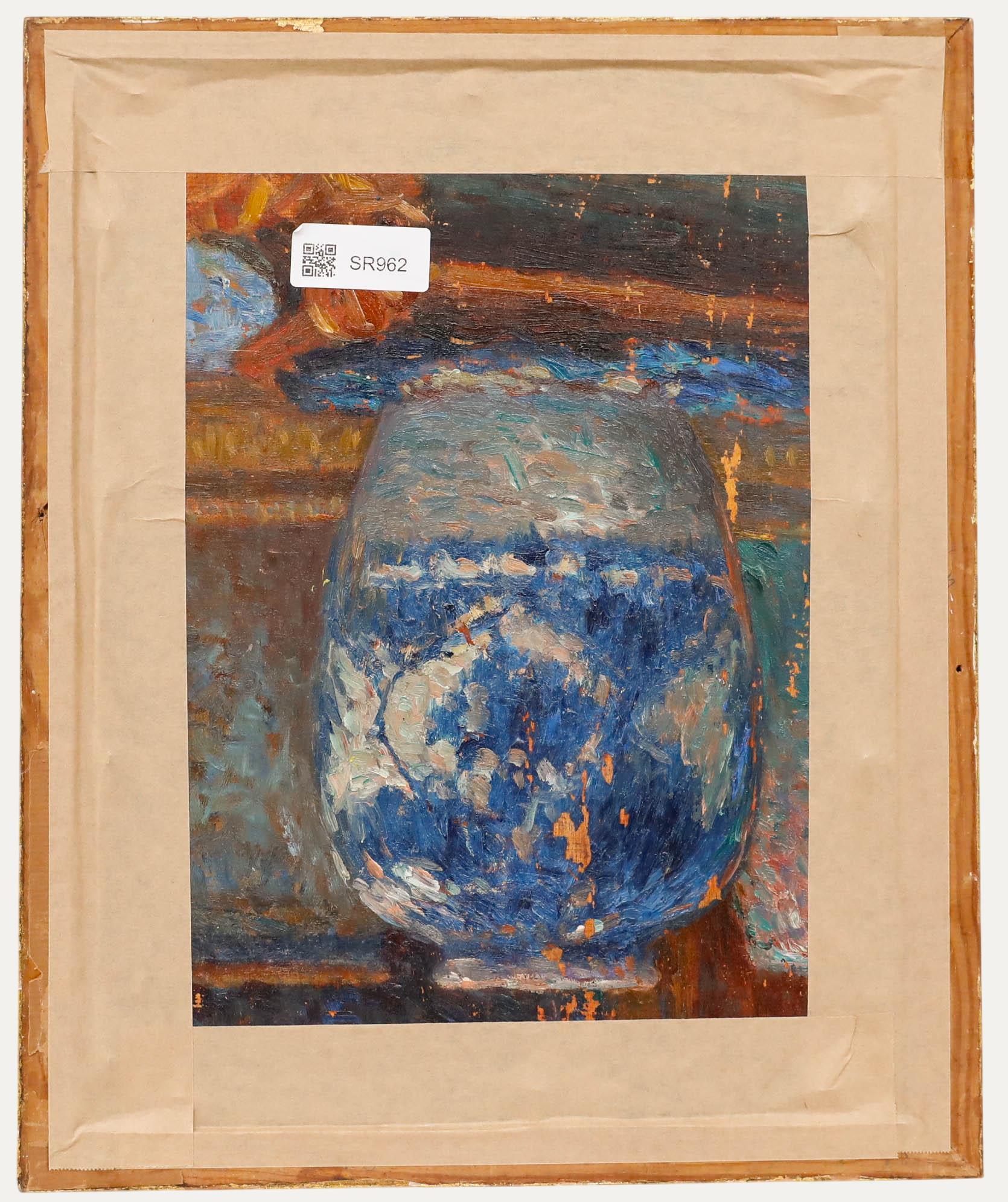 A charming study depicting blue delphiniums in an ornate blue and white china vase. Unsigned. Well presented in a swept gilt frame. Another oil study of a vase can be seen to the reverse of the board. On board.