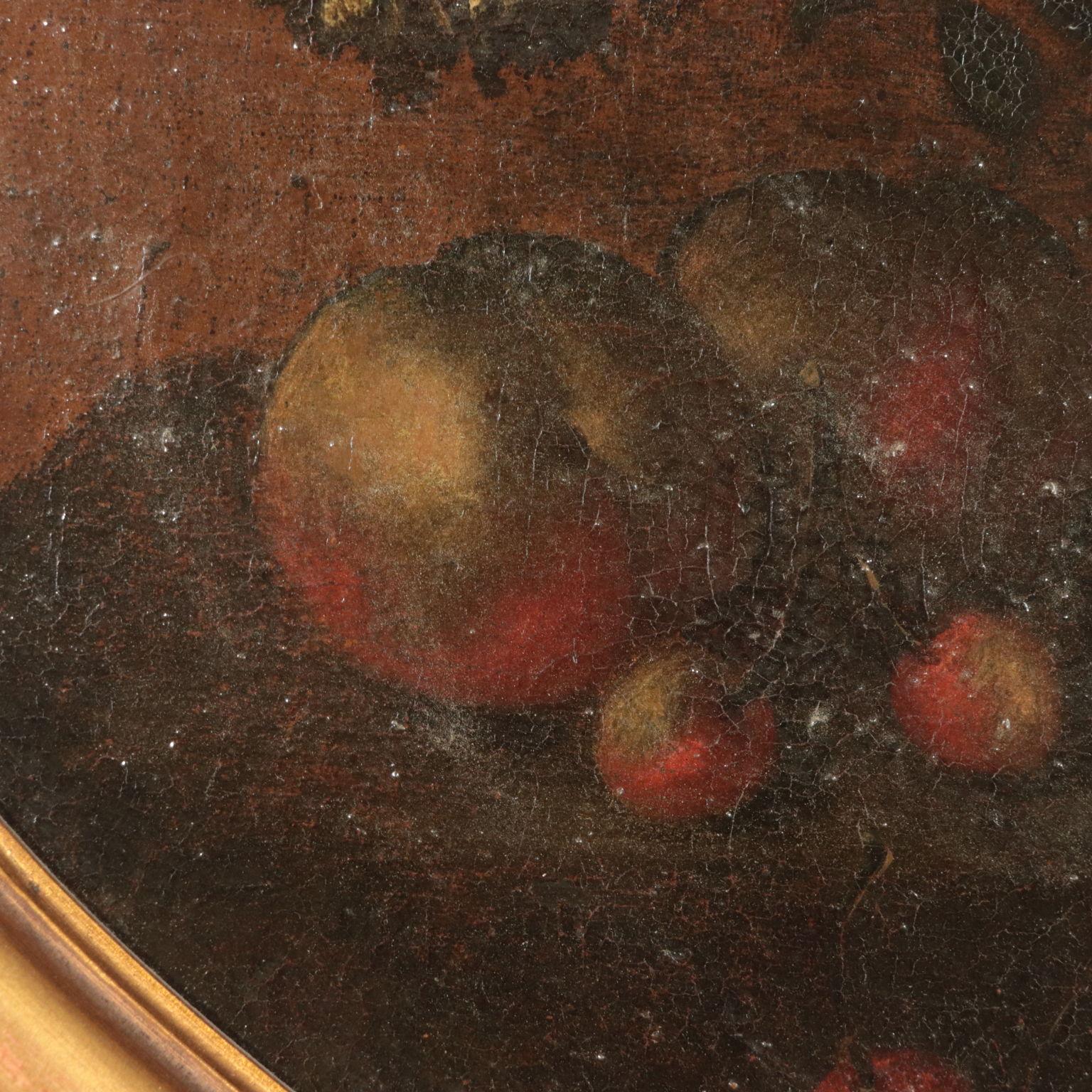 Oil on canvas.
It is a rich flower composition, presented in an embossed metal vase, with some fruit at its feet (figs, peaches, cherries).
From the Tuscany area, the piece reminds of the work of Andrea Scacciati, leading figure for still life