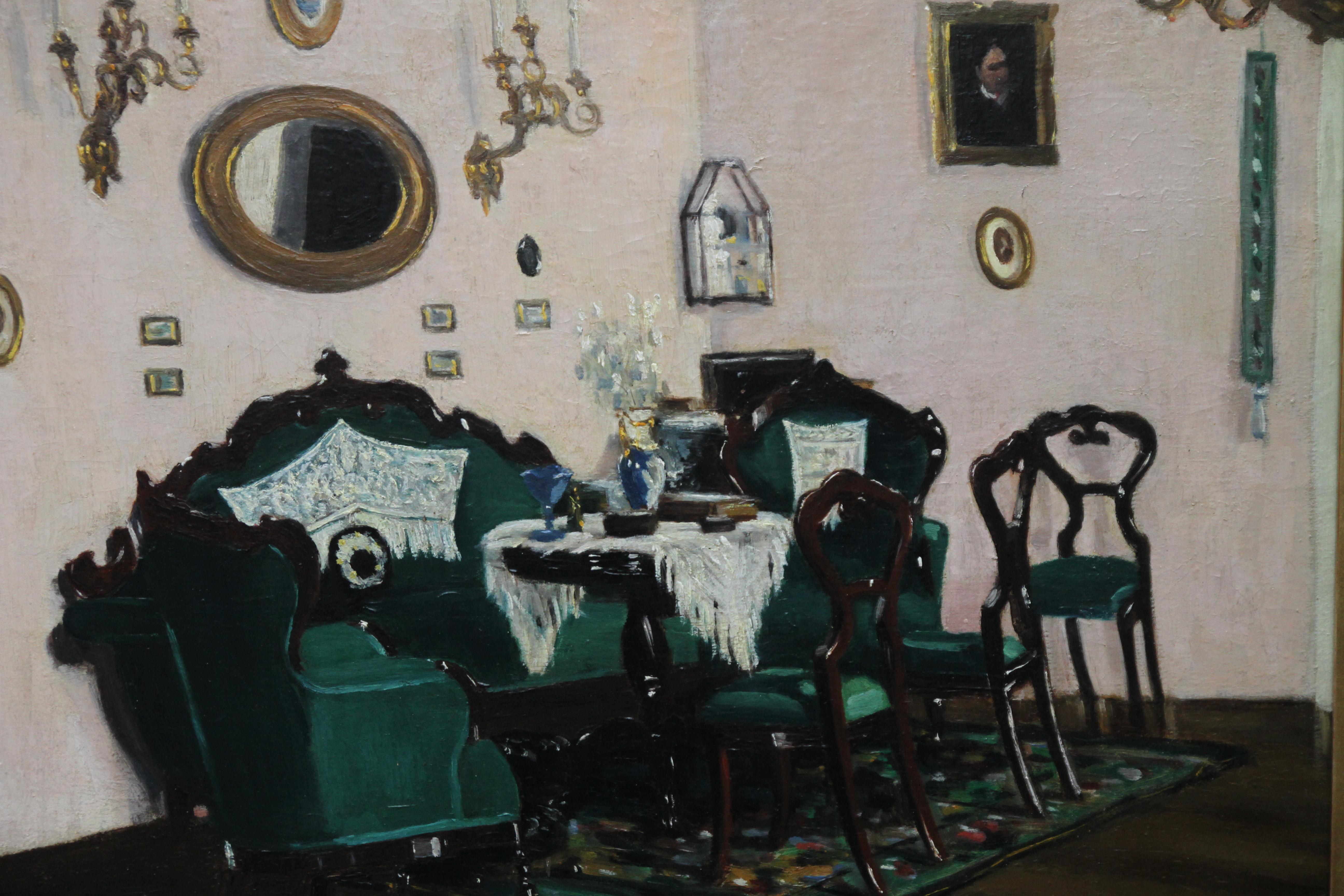 This stunning oil painting was painted circa 1911 and is signed lower right. The painting depicts a Scottish interior- a small occasion or card table surrounded by a variety of mahogany chairs upholstered in a gorgeous peacock green velvet. Various