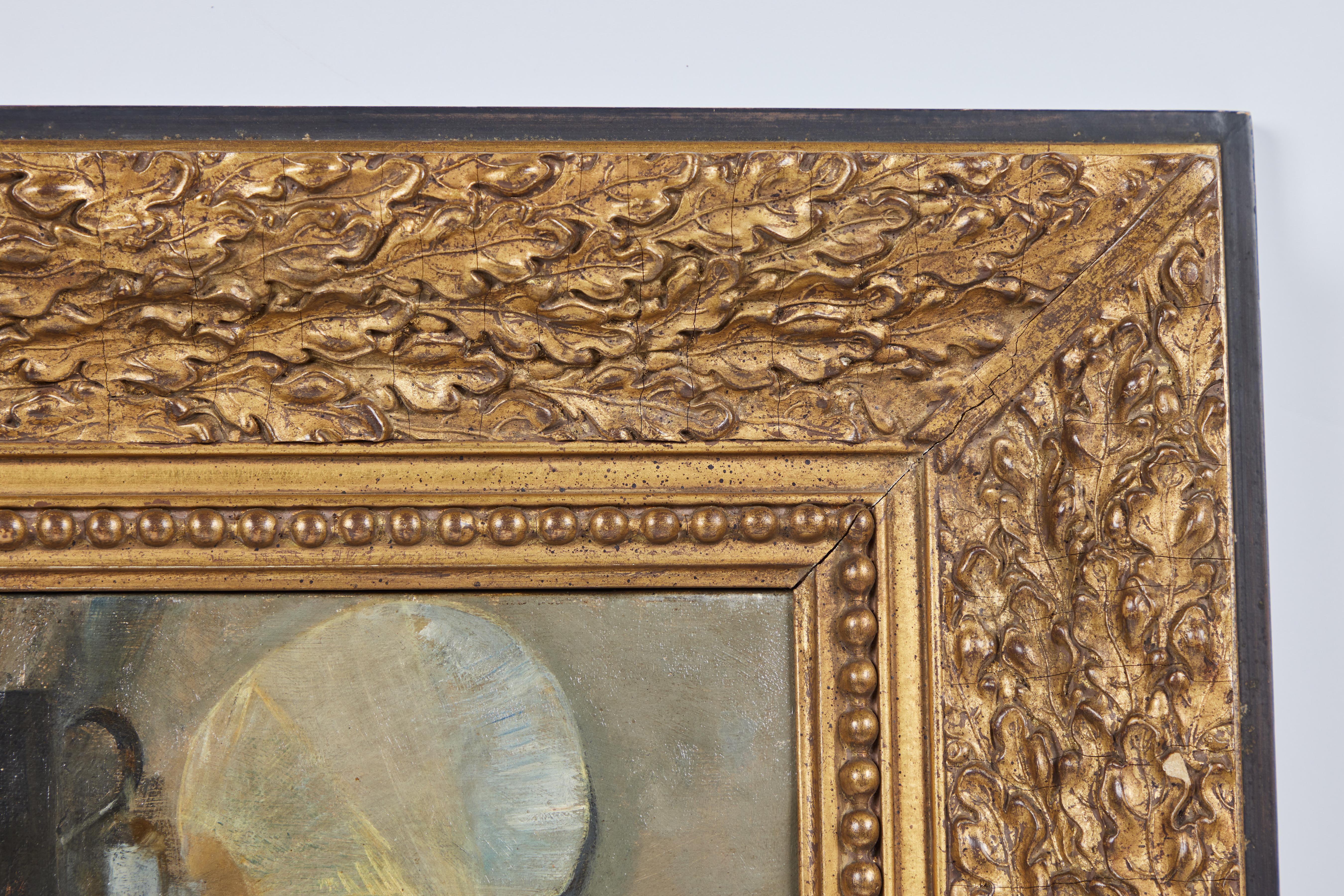 A charming picture of two sitting, attentive dogs. Signed and dated. Hand carved and gilded frame.