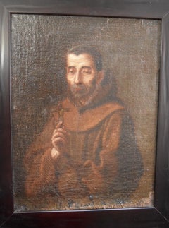 Spanish School 17th Century, Saint Francis holding a cross, oil on canvas