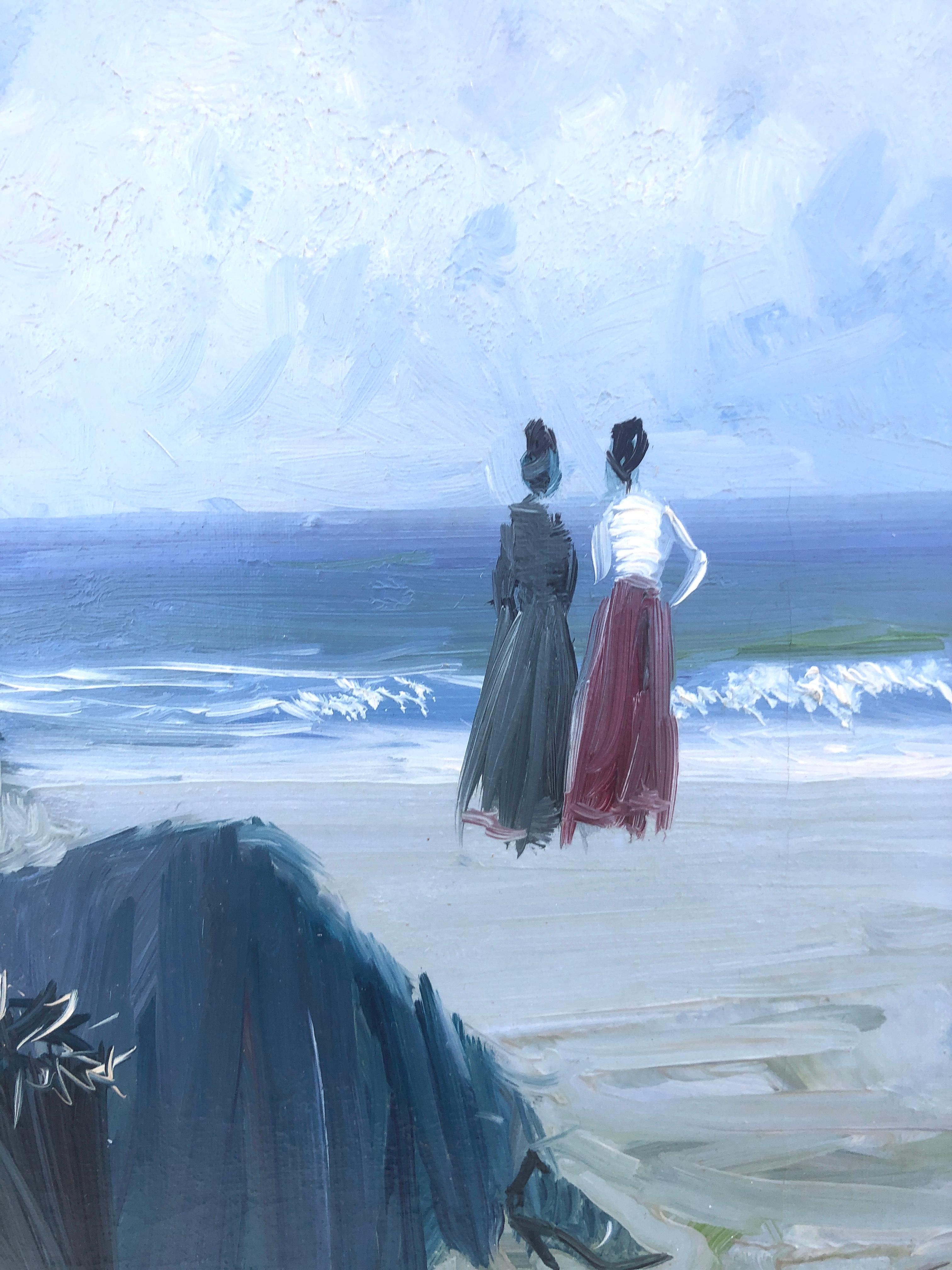two women on the beach painting