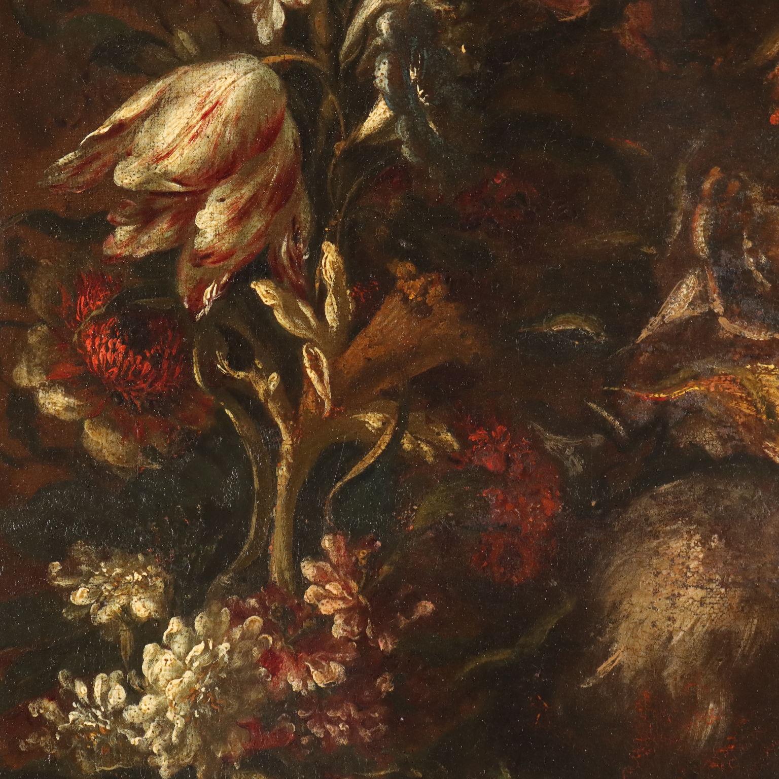 Oil on canvas. Lombard school of the eighteenth century. An almost garland-like composition of variegated flowers, which occupy the entire pictorial field, against a dark background from which they emerge by themselves, without any other furnishing