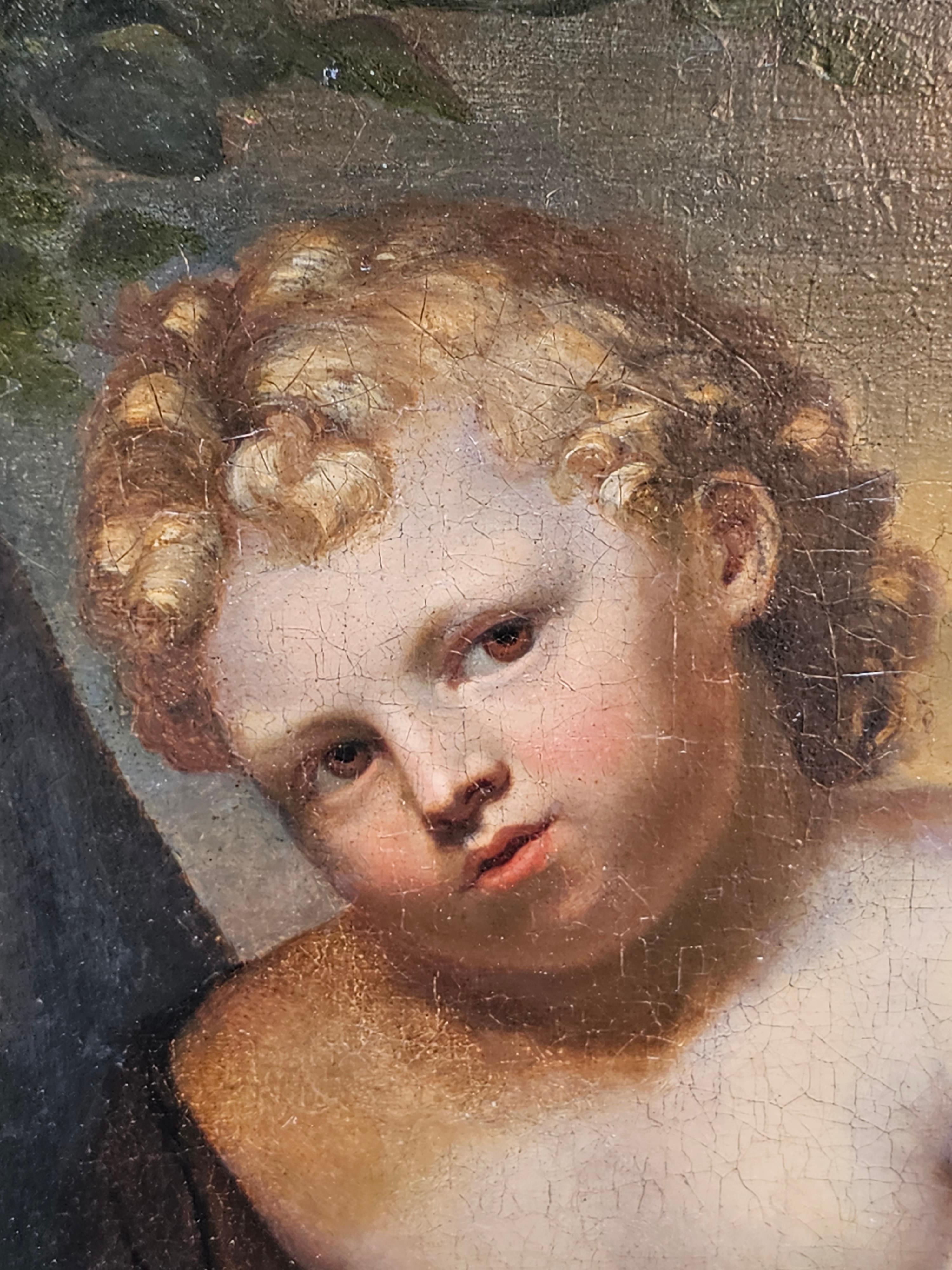 Cette magnifique peinture à l'huile de maître italien du XVIIIe siècle est tout à fait particulière. Peint vers 1750, le sujet est Saint John le Baptiste en tant que très jeune enfant. Il est assis,  Il porte une robe sur une épaule et un agneau est