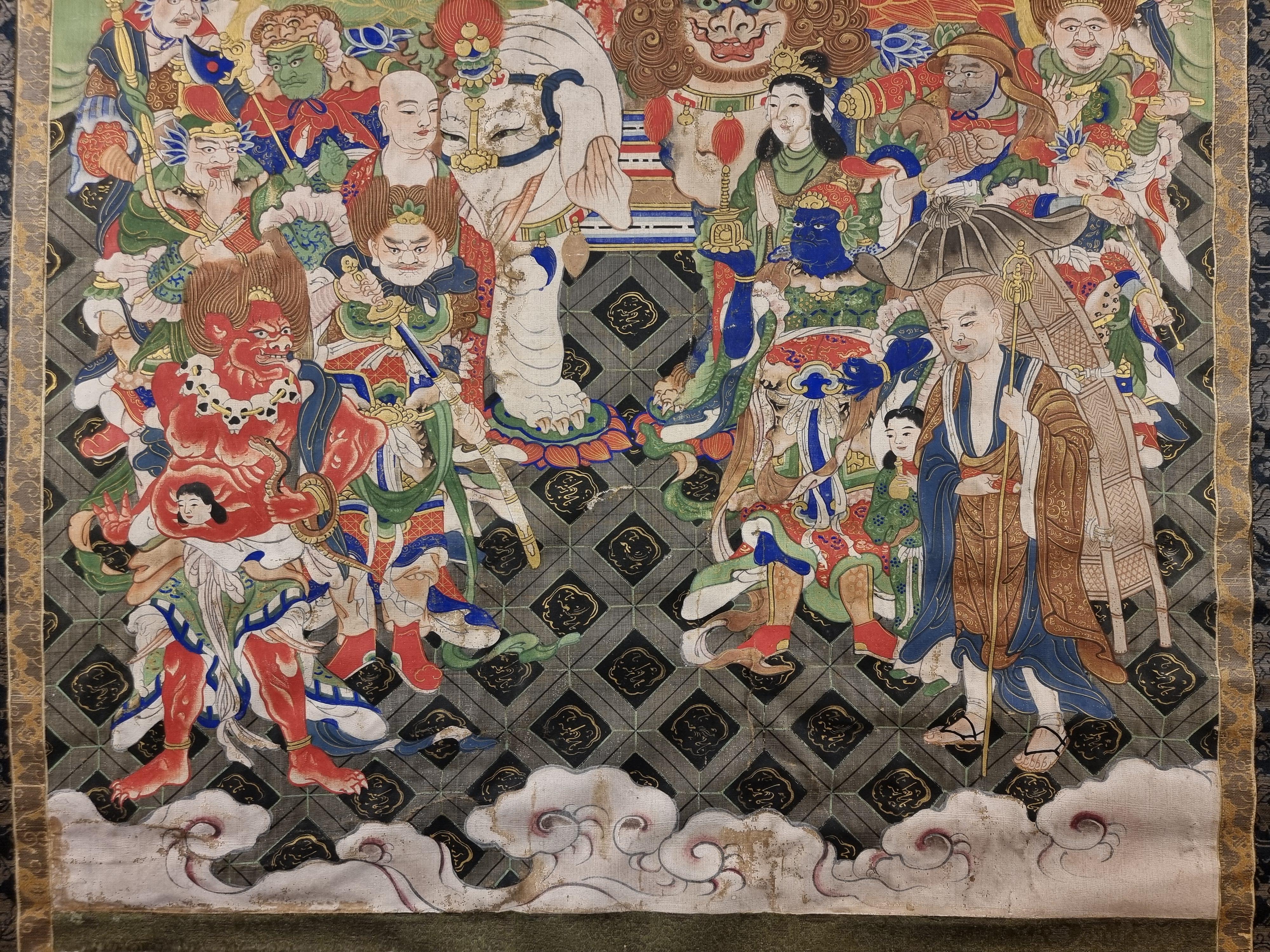 Thangka tibetano raffigurante un buddha d'oro - Painting di Unknown