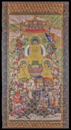 Antique Tibetan thangka depicting a golden buddha