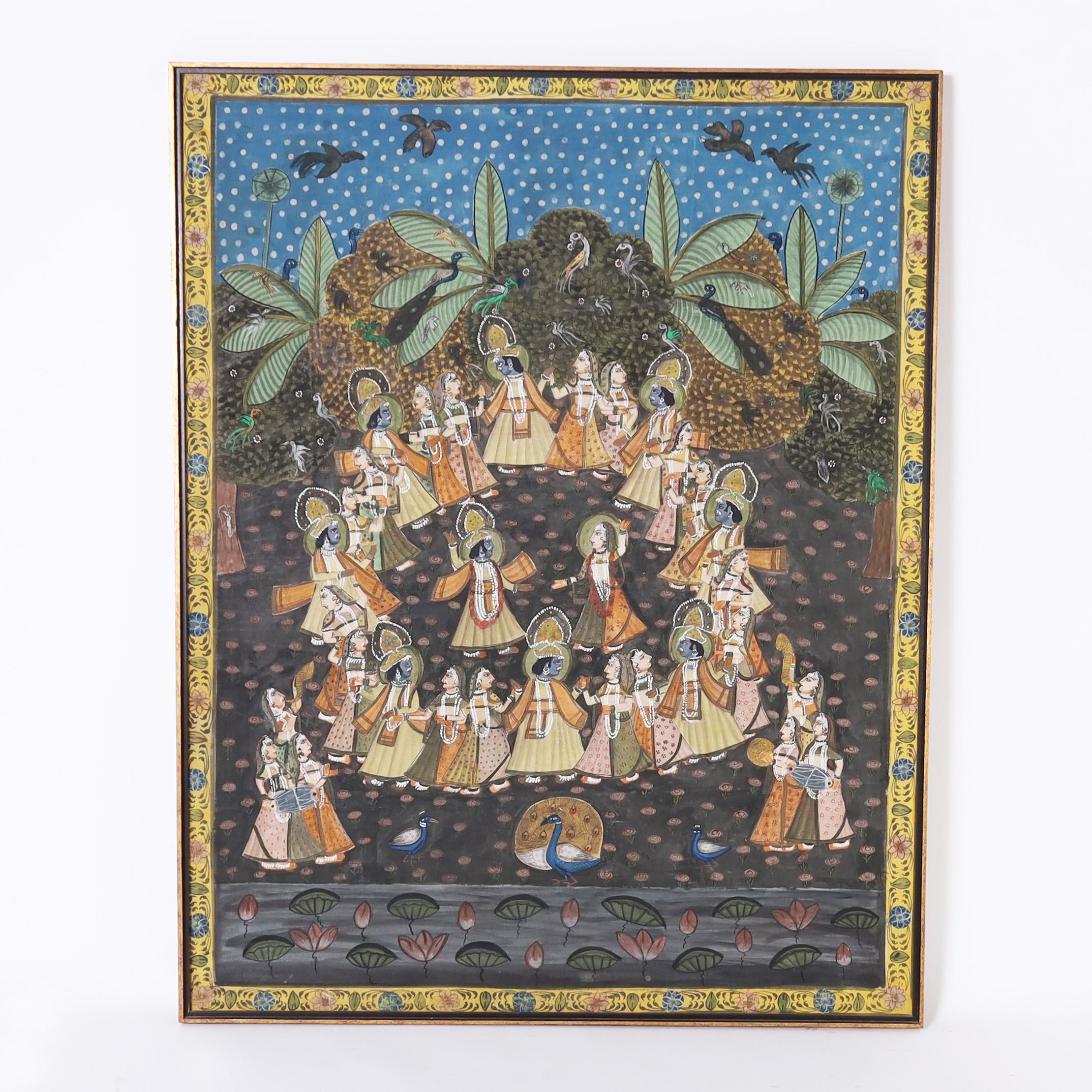 Enchanting vintage Anglo Indian Pishhwai gouache painting on cloth mounted on board, steeped in alagorical context, depicting Krishna dancing with villagers in a background of birds and trees. Presented in the original mahogany frame.