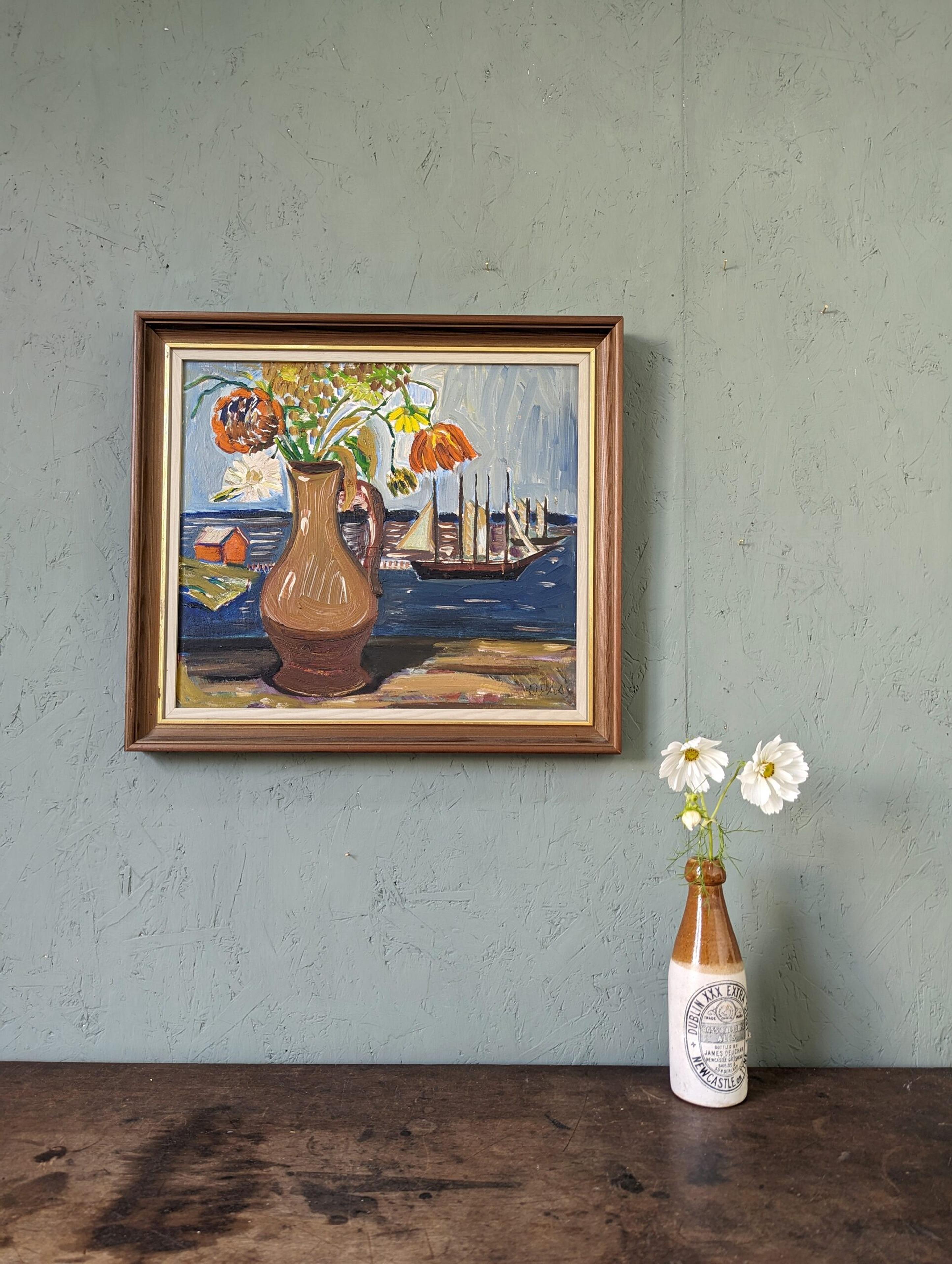 SAIL BOATS & FLOWERS
Size:  43 x 48 cm (including frame)
Oil on Board

A fantastic and confidently executed expressionist mid-century composition, painted in oil onto board.

A large brown vase filled with striking orange and yellow flowers