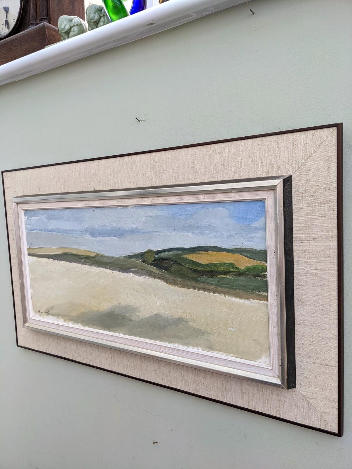 PANORAMA
Size: 44 x 75 cm (including frame)
Oil on canvas

A panoramic mid century modernist landscape composition in oil, painted onto canvas.

This restful composition depicts a far reaching landscape sitting under blue skies. The artist has used